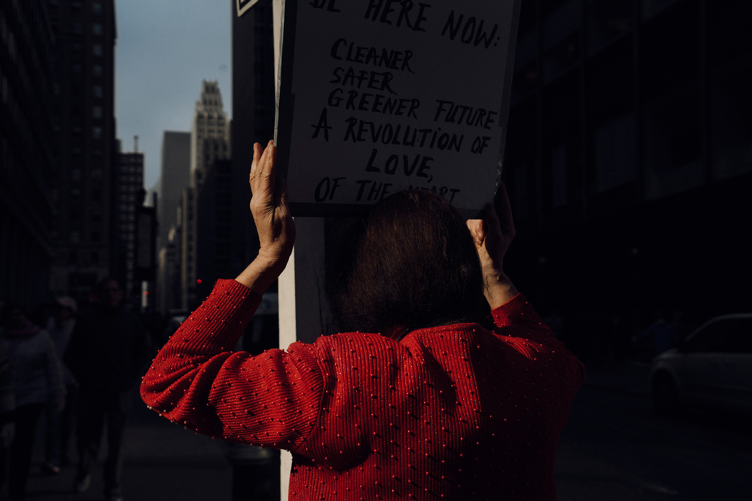 Women's March in Midtown the day after Donald Trump was inaugurated as President. Francine Vidal carries her sign in the march. New York, January 21, 2017.