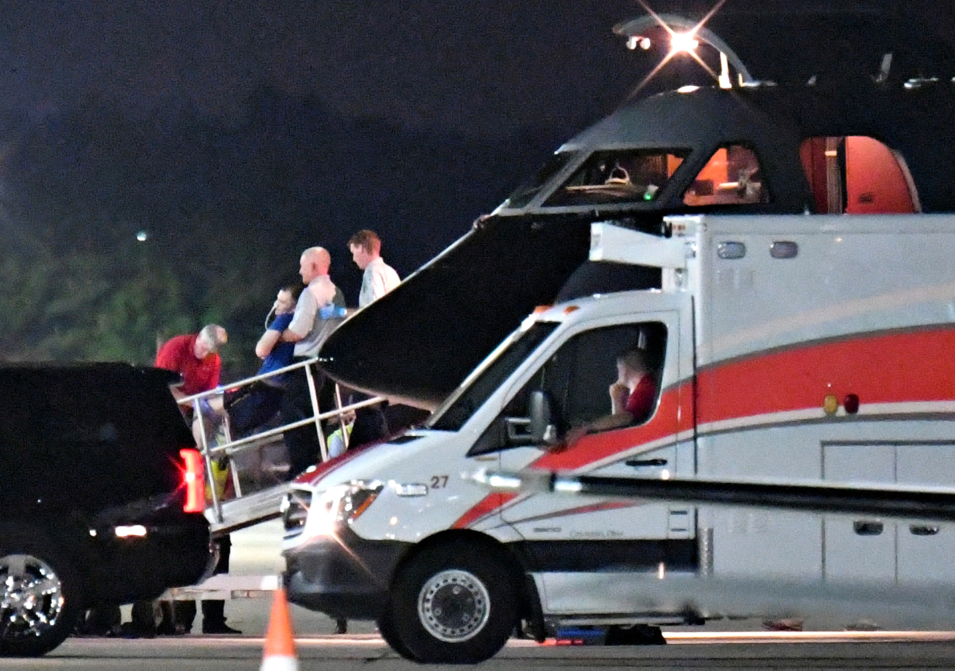 A person believed to be Otto Warmbier is transferred from a medical transport airplane to an awaiting ambulance at Lunken Airport in Cincinnati