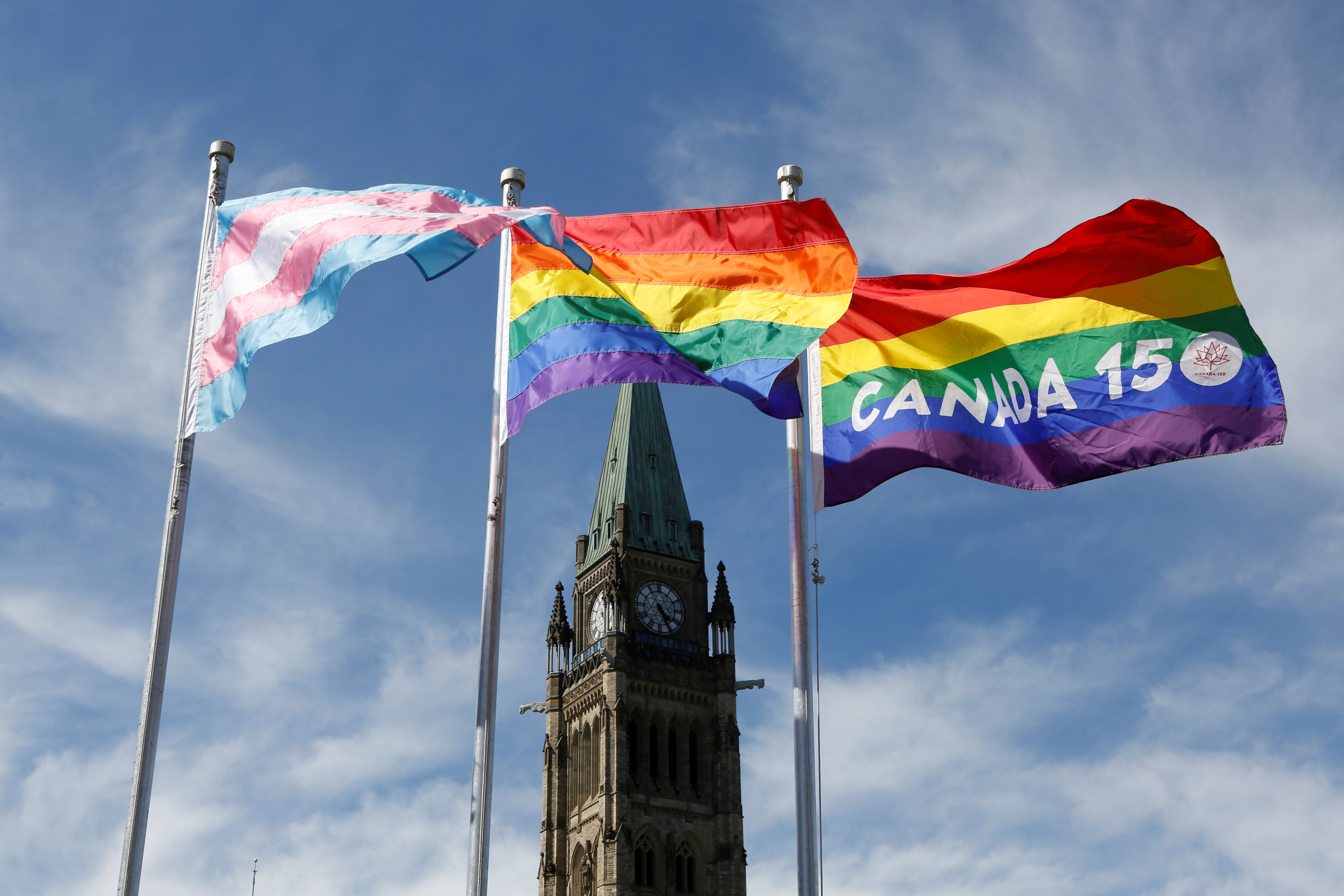 Pride flags fly on Parliament Hill in Ottawa, June 14, 2017. (Chris Wattie—Reuters)