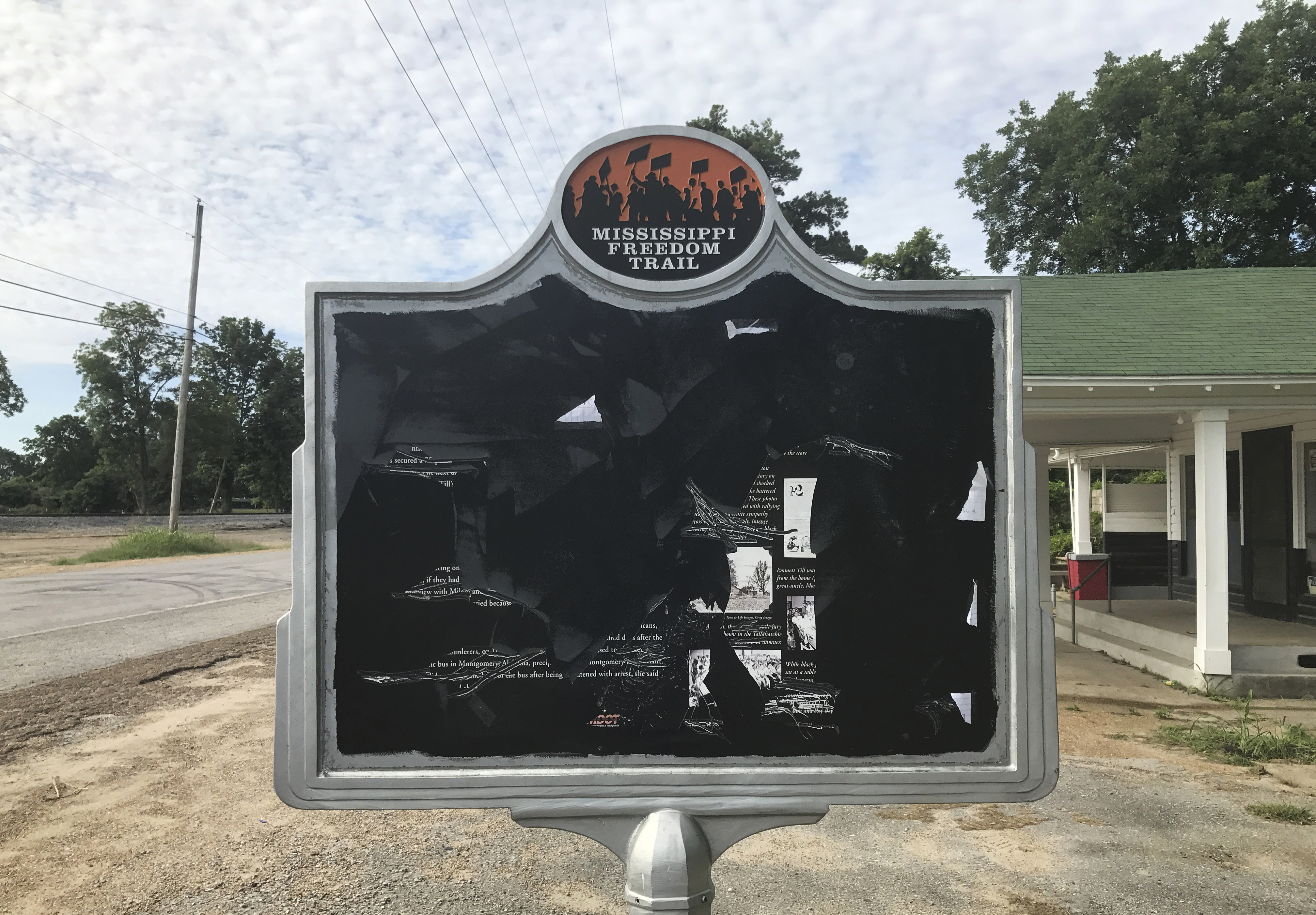 A civil rights historical marker remembers black teenager Emmett Till, who was kidnapped before being lynched in 1955. Allan Hammons, whose public relations firm made the marker, said Monday that someone scratched the marker with a blunt tool. (Allan Hammons—AP)