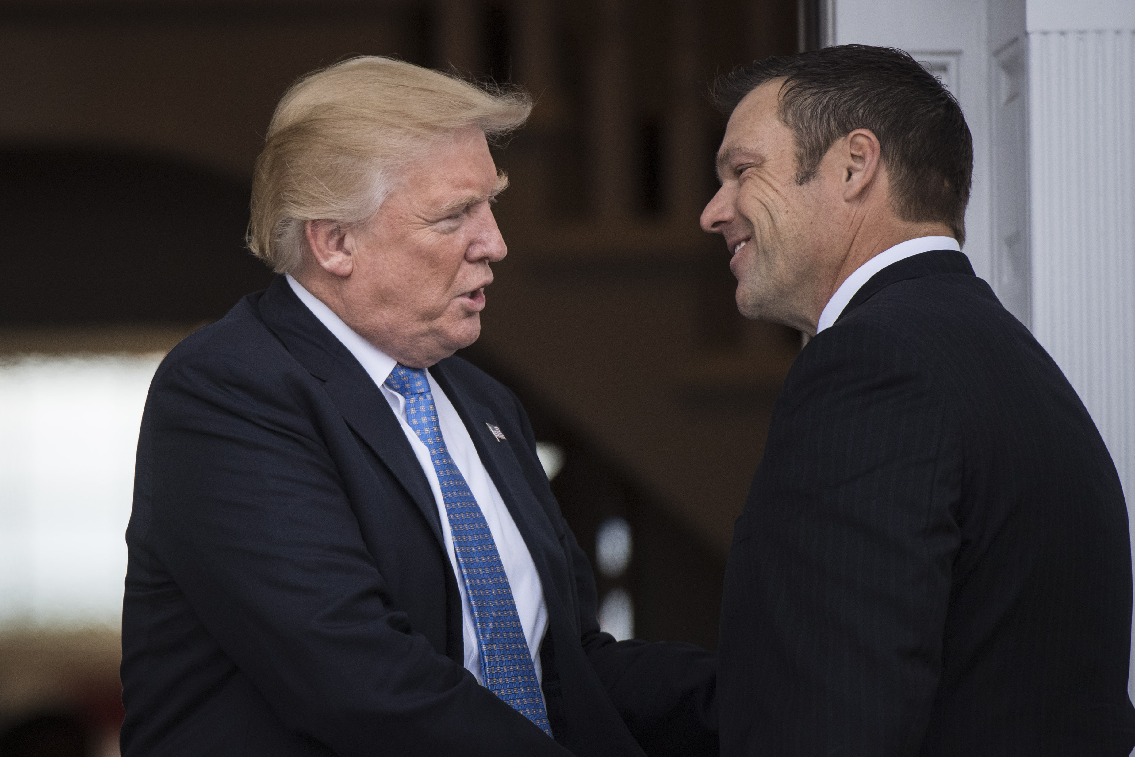 President-elect Donald Trump greets Kansas Secretary of State, Kris Kobach, at the clubhouse at Trump National Golf Club Bedminster in Bedminster Township, N.J. on Sunday, Nov. 20, 2016. (The Washington Post--;The Washington Post/Getty Images)