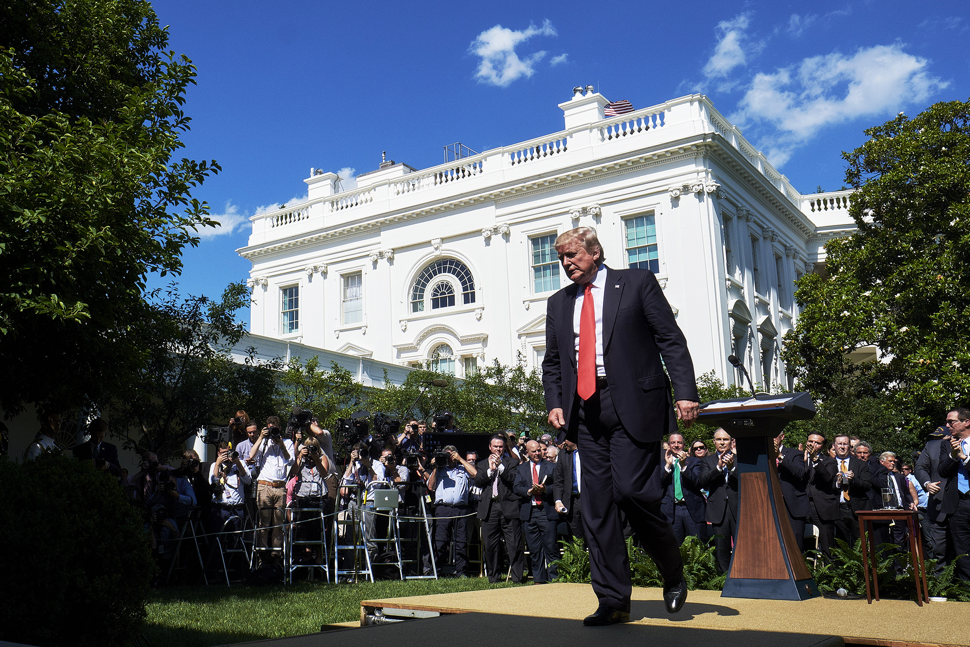 Donald Trump exits following an announcement in the Rose Garden of the White House that the U.S. would leave the Paris climate pact in Washington, D.C., U.S., on June 1, 2017. (T.J. Kirkpatrick—Getty Images)