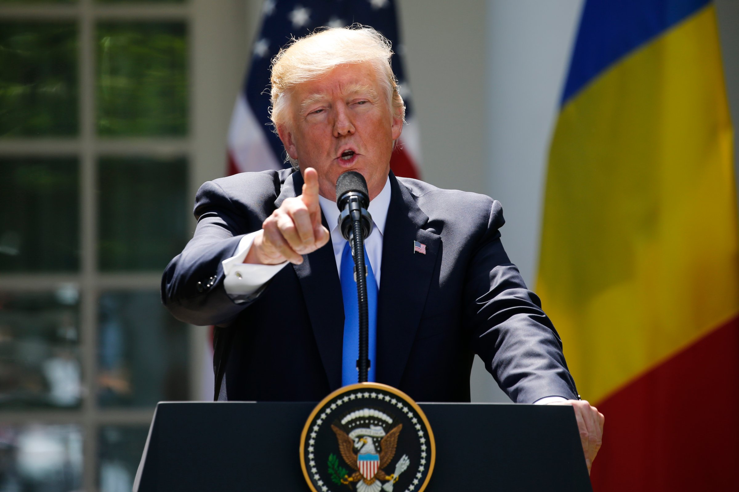 Trump reacts to a reporter's question during a joint news conference with Romanian Iohannis in the Rose Garden at the White House in Washington
