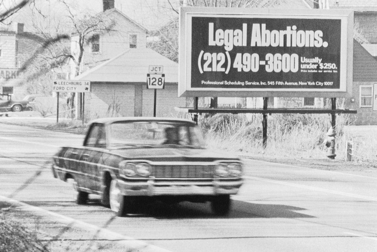 A billboard on Rt. 66 advertises legalized abortions in New York in 1971, during the period when abortion was only legal in some states. (Bettmann / Getty Images)