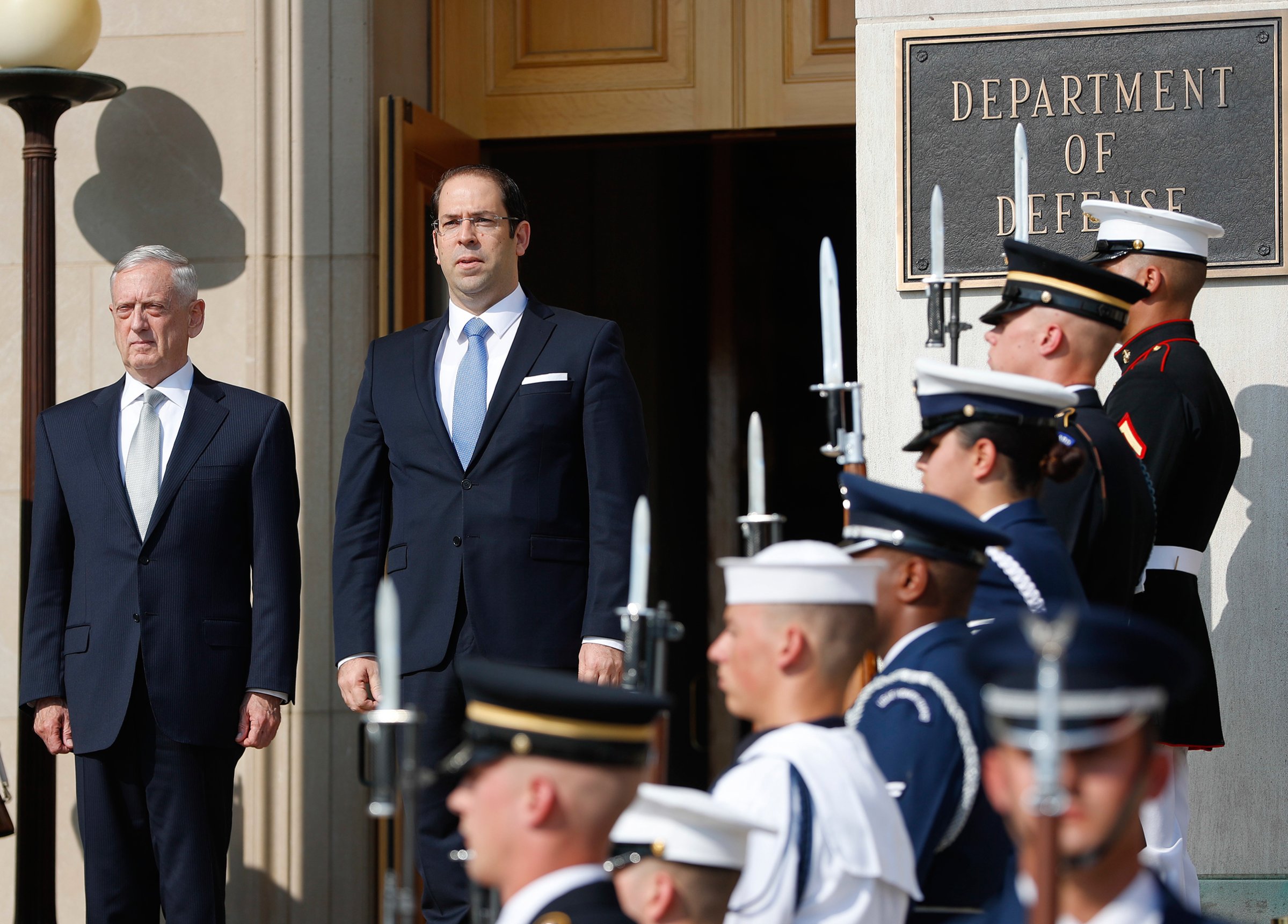 Defense Secretary Jim Mattis, left, hosts an enhanced honor cordon for Tunisian Prime Minister Youssef Chahed at the Pentagon, July 10, 2017.