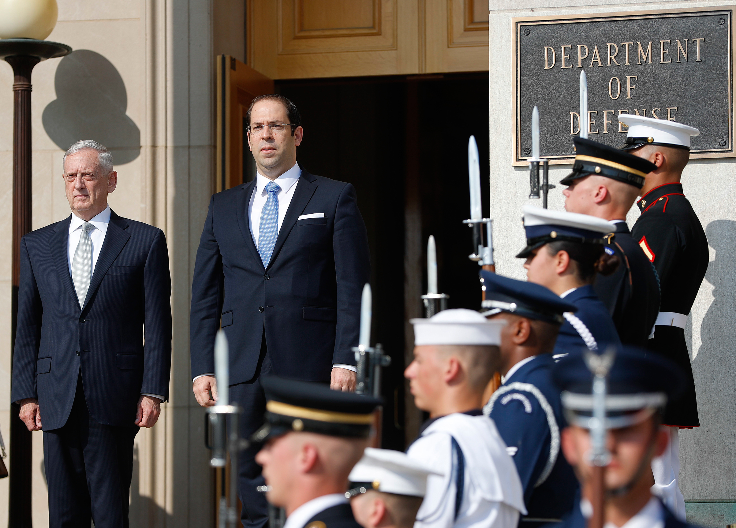 Defense Secretary Jim Mattis, left, hosts an enhanced honor cordon for Tunisian Prime Minister Youssef Chahed at the Pentagon, July 10, 2017. (Pablo Martinez Monsivais—AP)