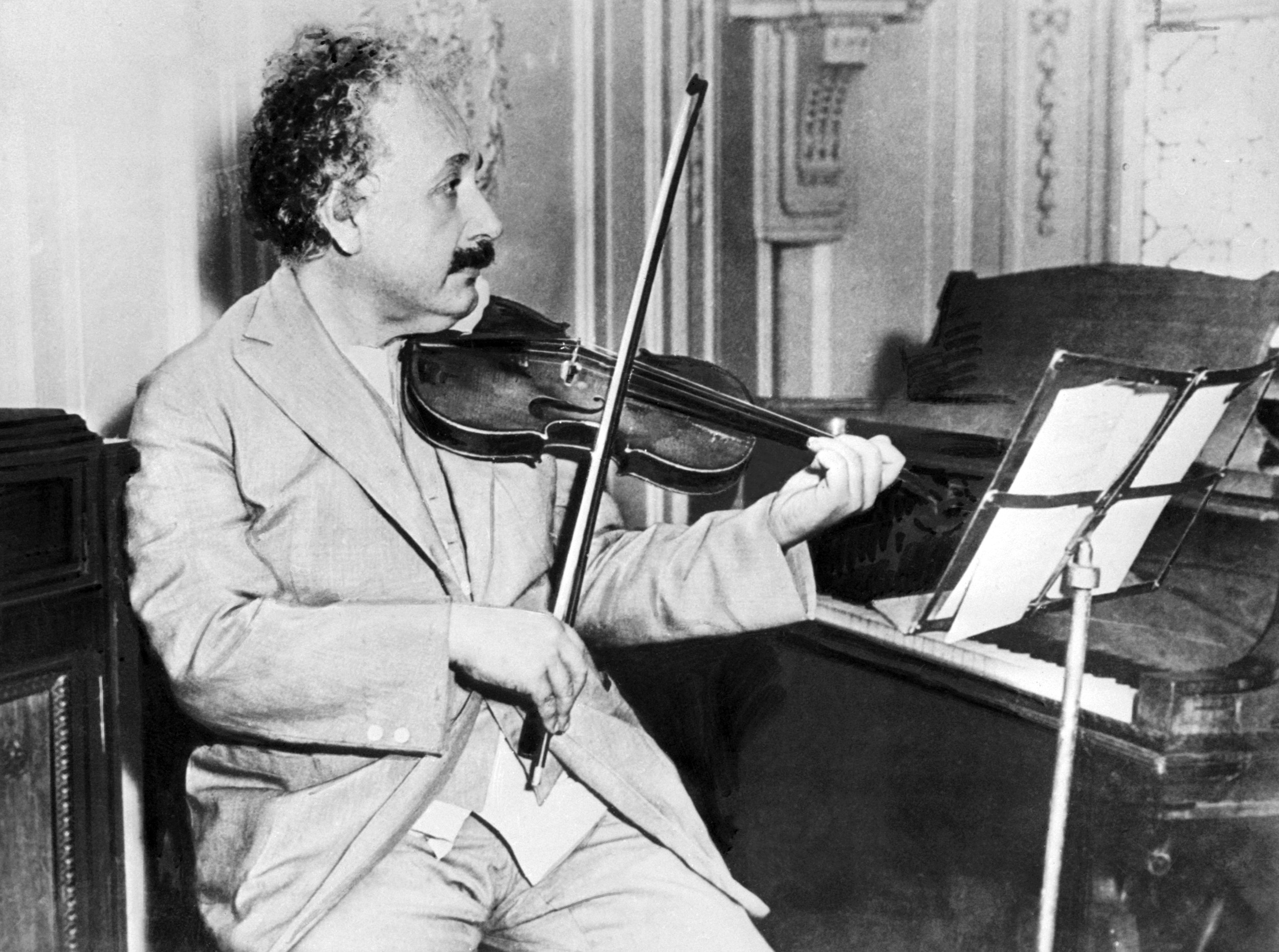 German-born Swiss-American physicist Albert Einstein (1879–1955), author of theory of relativity, awarded the Nobel Prize for Physics in 1921, playing the violin in 1931. (AFP&mdash;AFP/Getty Images)