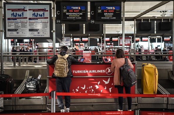U.S. passengers queue at a check-in area on March 22, 2017 at the Ataturk International Airport in Istanbul. (OZAN KOSE—AFP/Getty Images)