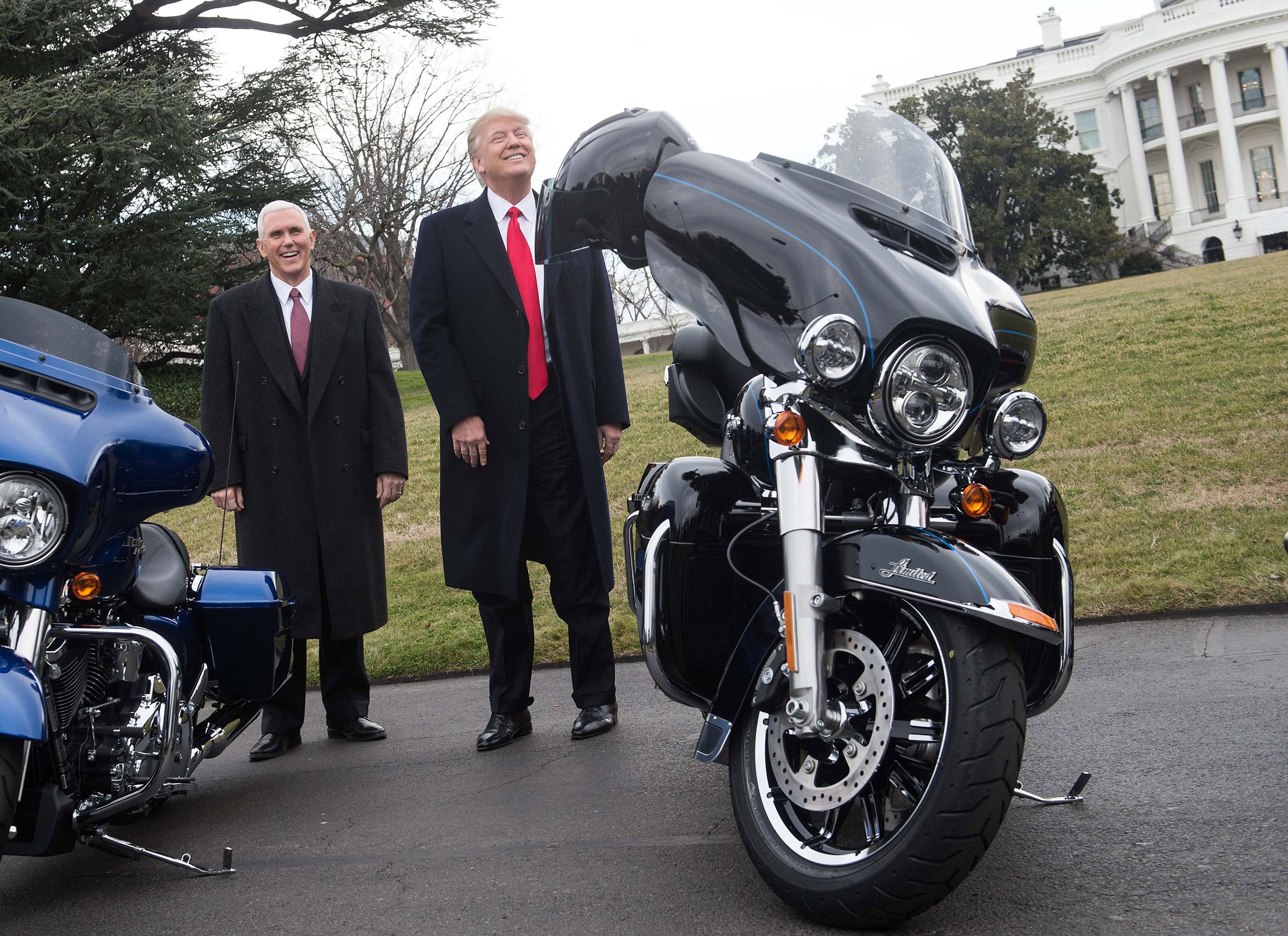 US President Donald Trump jokes with reporters after greeting Harley Davidson executives and union representatives on the South Lawn of the White House in Washington, DC, on February 2, 2017 prior to a luncheon with them.