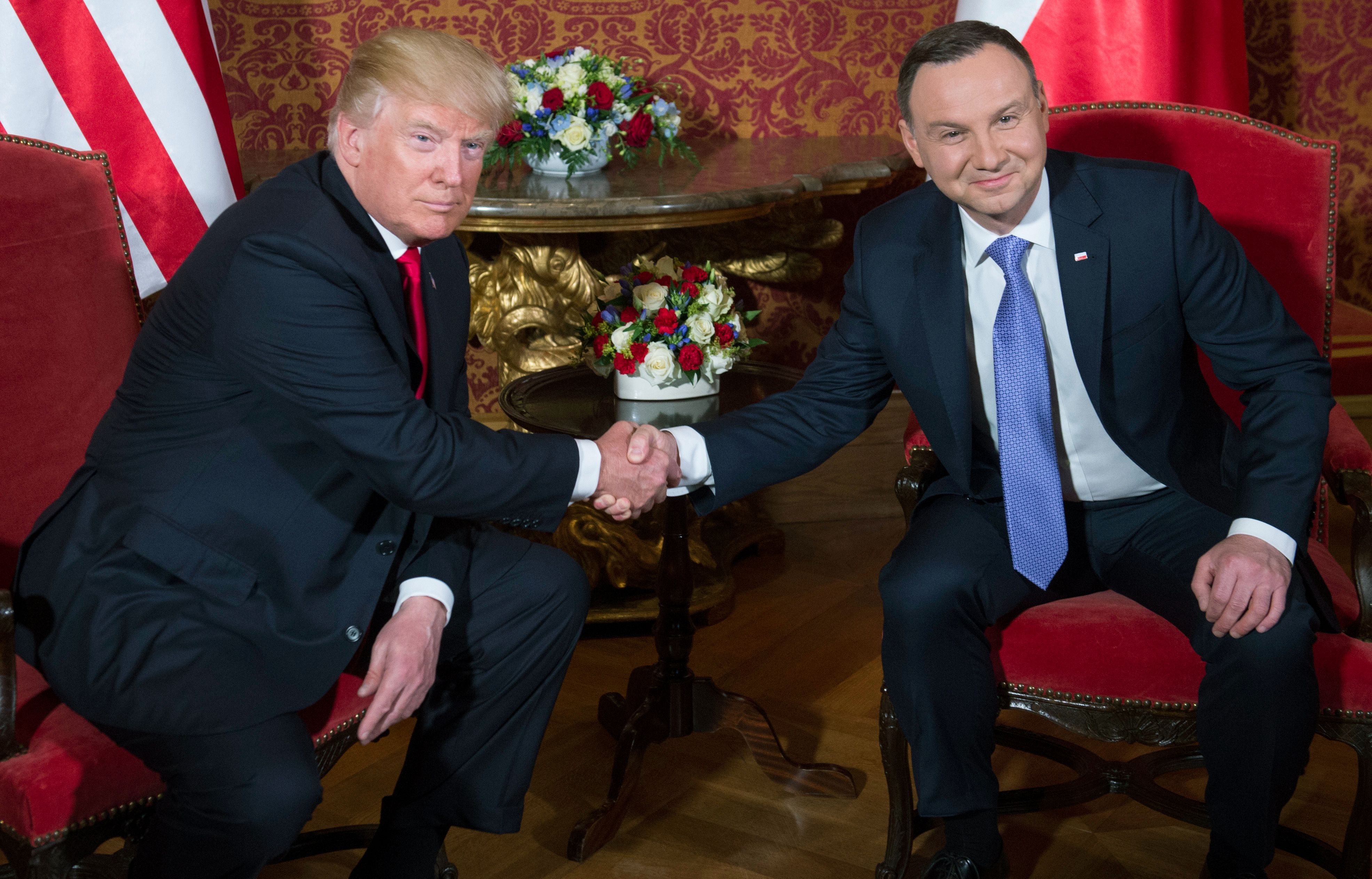 Polish President Andrzej Duda (R) and US President Donald Trump shake hands prior to a meeting at the Royal Castle in Warsaw, Poland, July 6, 2017. (SAUL LOEB—AFP/Getty Images)