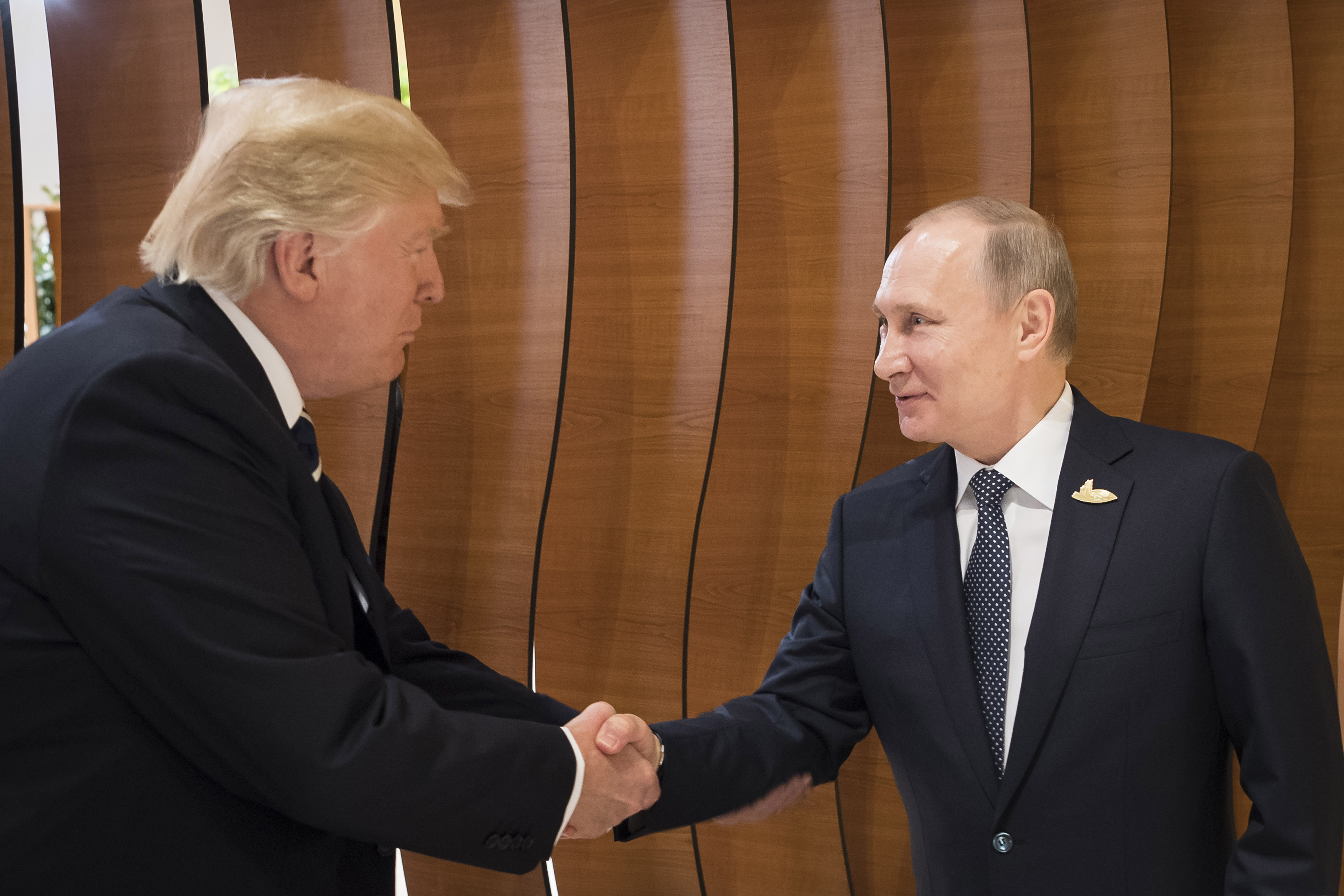In this photo provided by the German Government Press Office (BPA) Donald Trump, President of the USA (left), meets Vladimir Putin, President of Russia (right), at the opening of the G20 summit on July 7, 2017 in Hamburg, Germany. (Steffen Kugler /BPA via Getty Images)