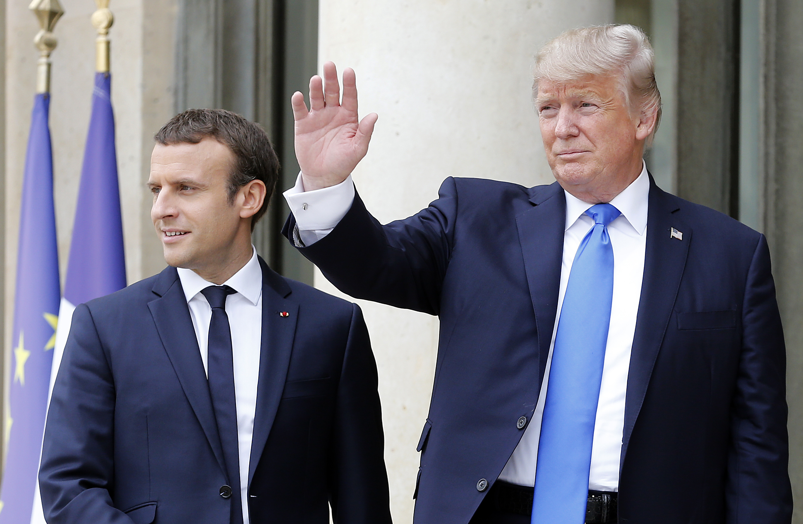 French President Emmanuel Macron welcomes US President Donald Trump prior to a meeting at the Elysee Presidential Palace on July 13, 2017 in Paris, France. (Thierry Chesnot—Getty Images)
