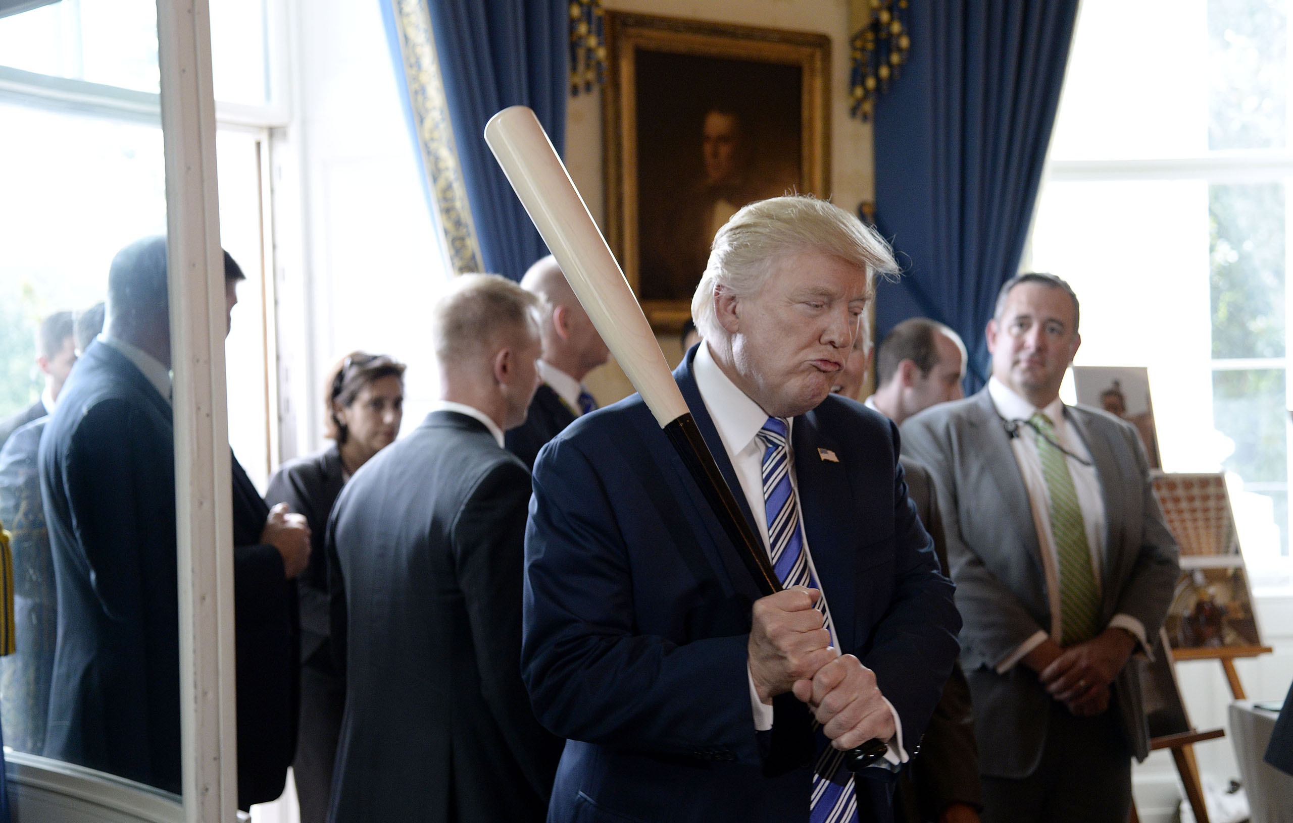 US President Donald Trump examines US-made products from all 50 states, including a Marucci baseball bat, in the Blue Room of the White House during a  Made in America  product showcase event in Washington, DC, on July 17, 2017.