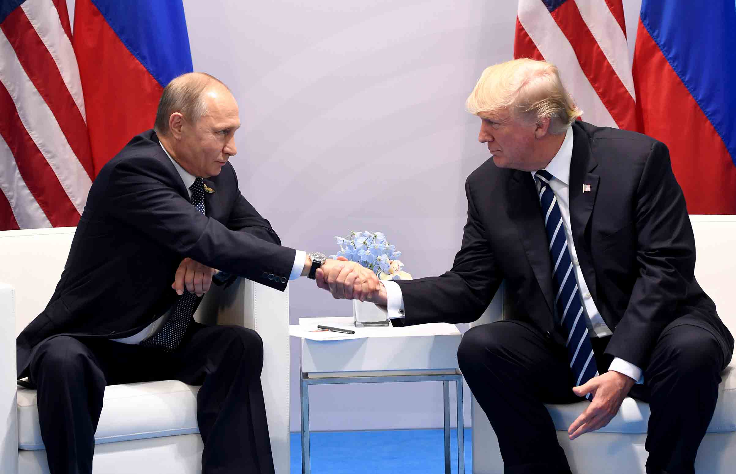 President Donald Trump and Russia's President Vladimir Putin shake hands during a meeting on the sidelines of the G20 Summit in Hamburg, Germany, on July 7, 2017. (Saul Loeb—AFP/Getty Images)