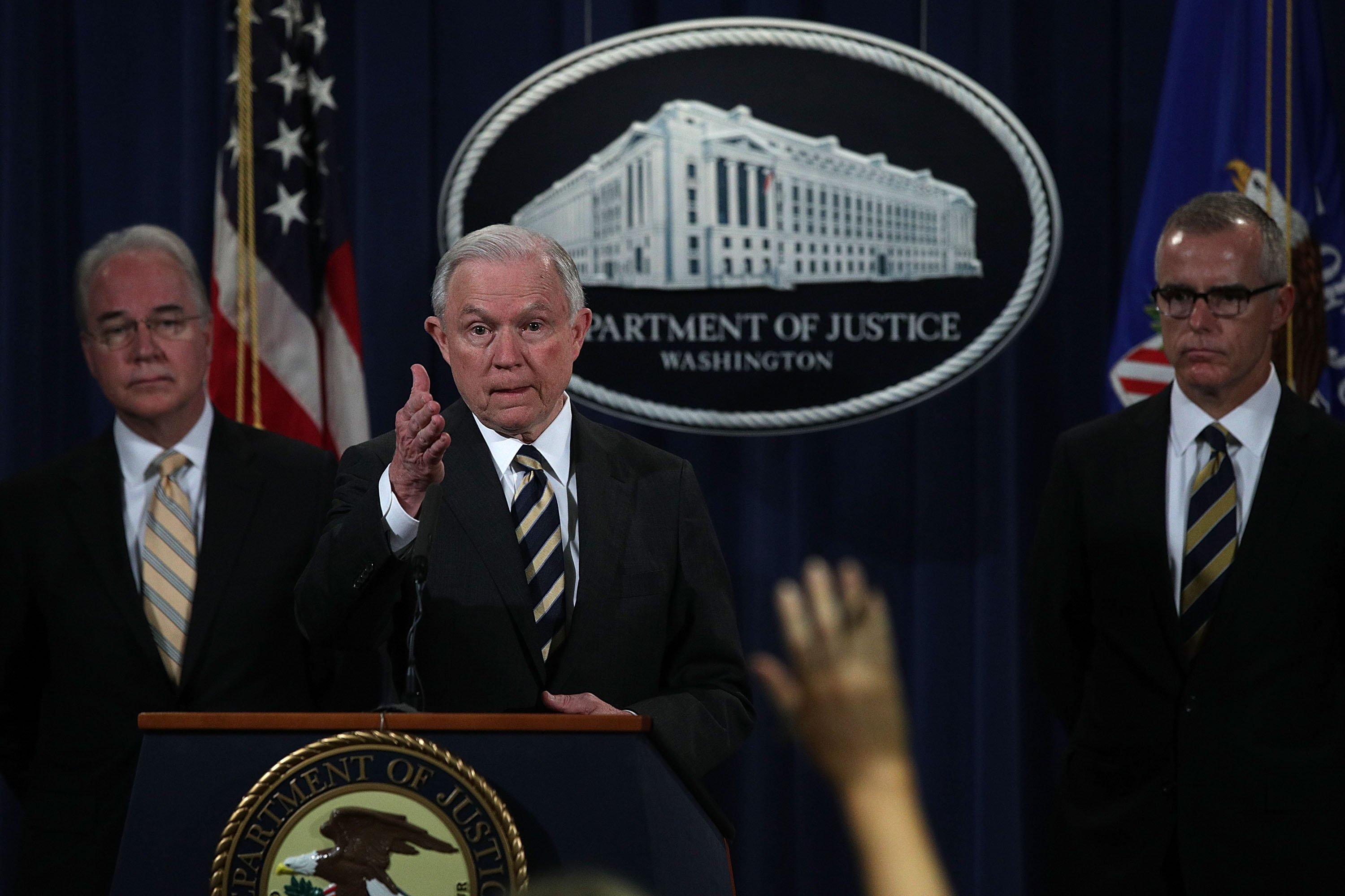 Attorney General Jeff Sessions takes questions as Acting FBI Director Andrew McCabe (R) and Secretary of Health and Human Services Tom Price (L) look on during a news conference to announce significant law enforcement actions July 13, 2017 at the Justice Department in Washington, D.C. (Alex Wong—Getty Images)