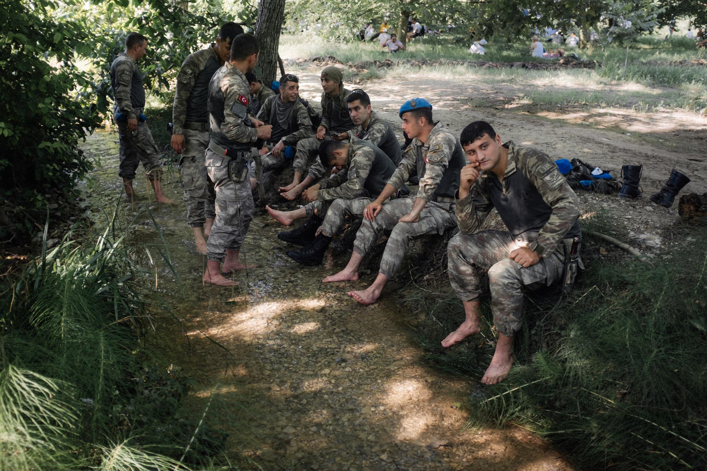 TURKEY, Sakarya. Turkish soldiers rests near stream during the break time at Justice March. More the march approaches Istanbul, more risks of confrontation are high. Erdogan accused Kilicdaroglu of staging “protests to protect terrorists and those who support terrorism”. At a weekend meeting of his ruling AK party, Erdogan said the CHP’s latest stance “had gone beyond being a political opposition and taken on a different proportion".Responding to Erdogan’s accusations, Kilicdaroglu said they were “fitting for a dictator”.2017