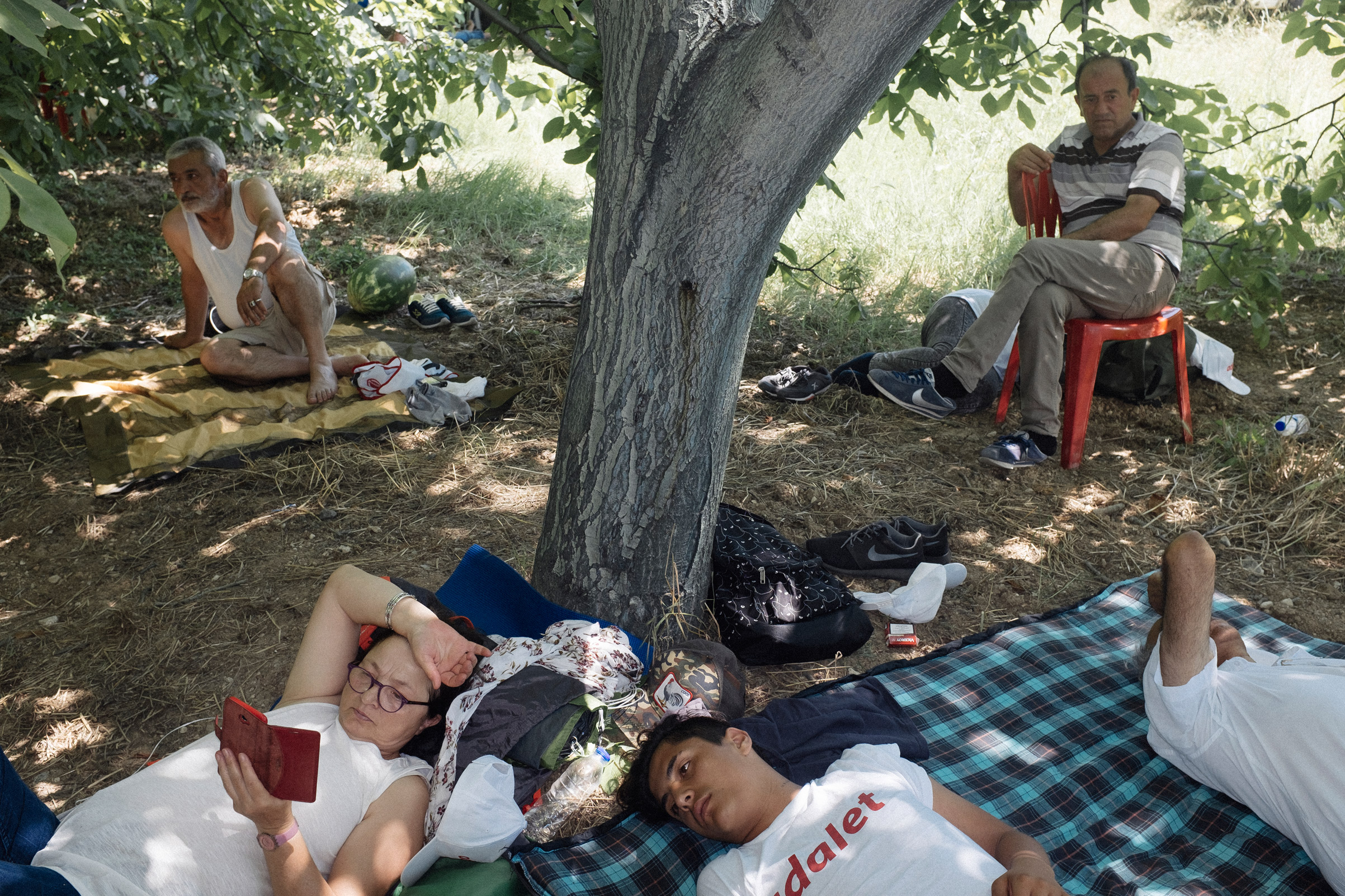 People take a break during the Justice March, Sakarya,Turkey, July 2, 2017.  Turkey has been suffering one of the most intense heat waves in a century. In this heat, thousands of people walk in shifts, led by the main opposition Republican People’s Party (CHP) leader Kemal Kilicdaroglu.