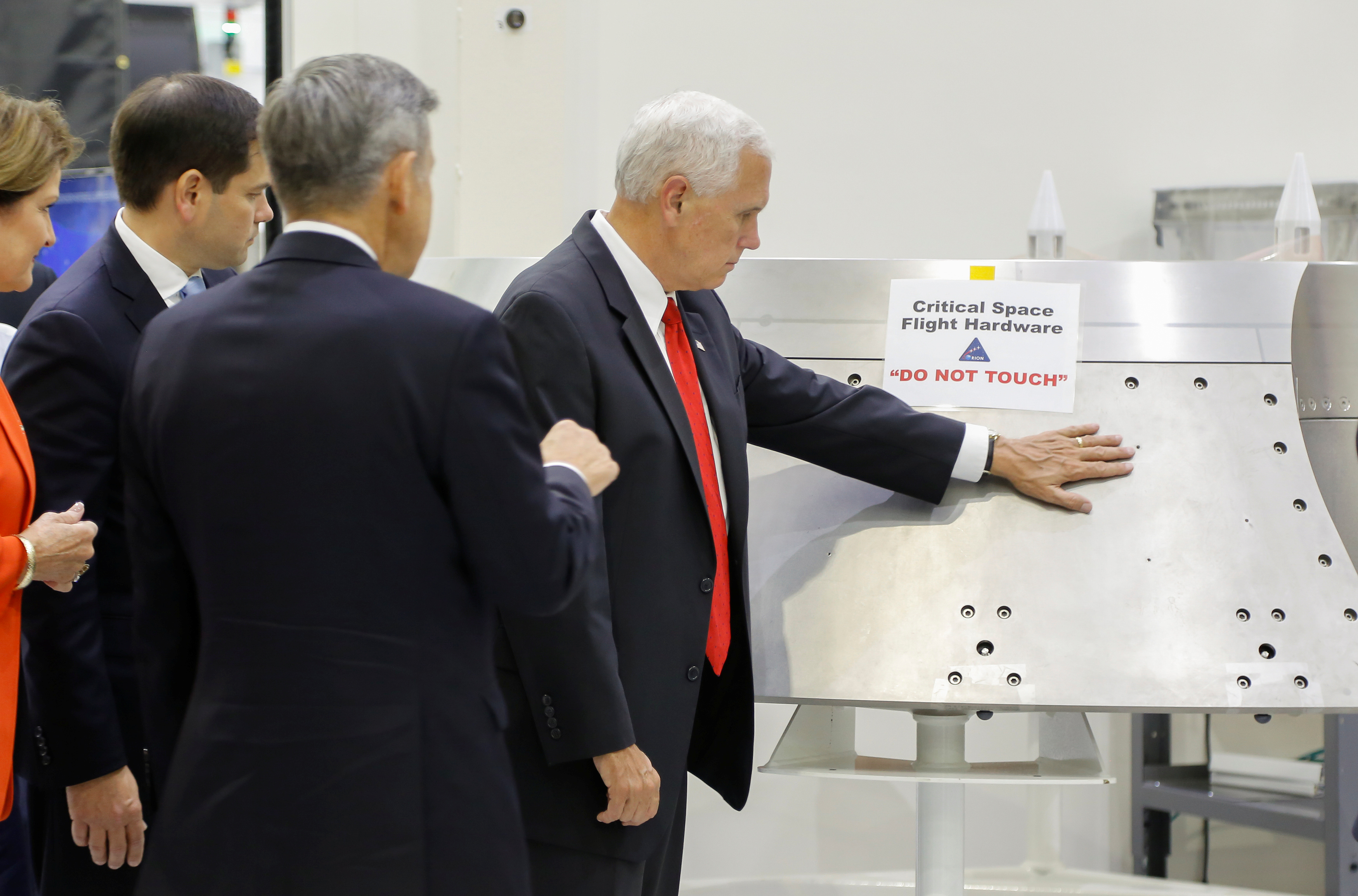Vice President Mike Pence is shown a piece of hardware by Kennedy Space Center Director Robert Cabana during a tour of the Operations and Checkout Building in Florida, July 6, 2017. (Mike Brown—Reuters)
