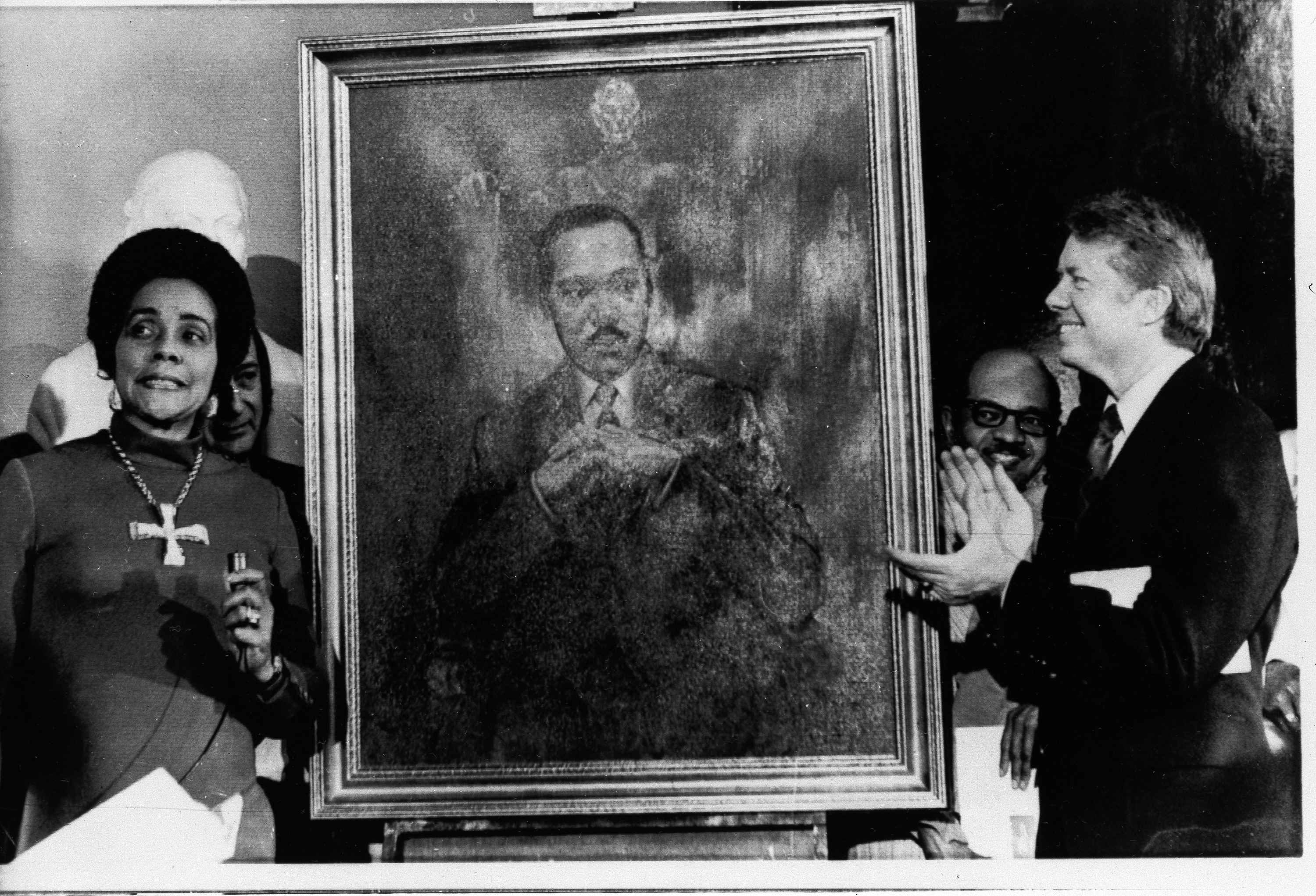 Coretta Scott King, widow of slain civil rights leader Dr. Martin Luther King, Jr., speaks at an unveiling of a portrait of Dr. King by artist George Mandus, Feb. 18, 1974, and dedicated by Gov. Jimmy Carter. (AP)
