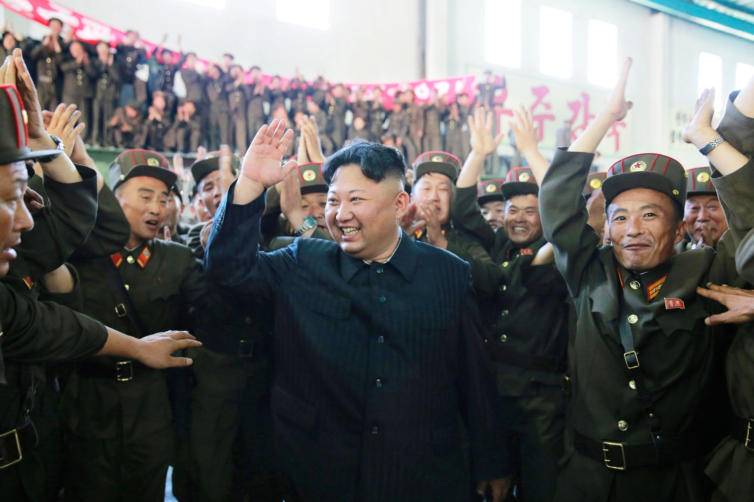 Kim celebrates the test launch of the Hwasong-14 ICBM in this photo released by the North Korean government on July 5