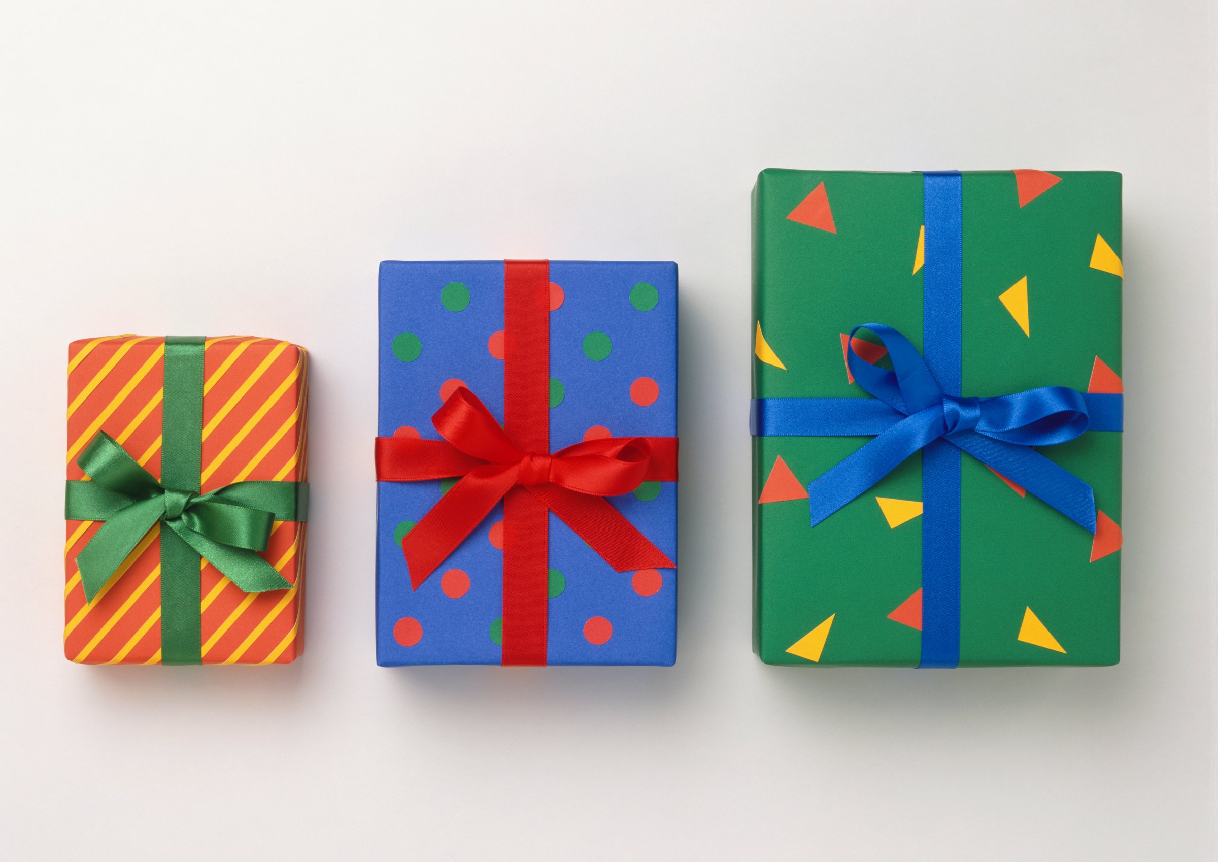 Three colourfully wrapped, different size boxes.