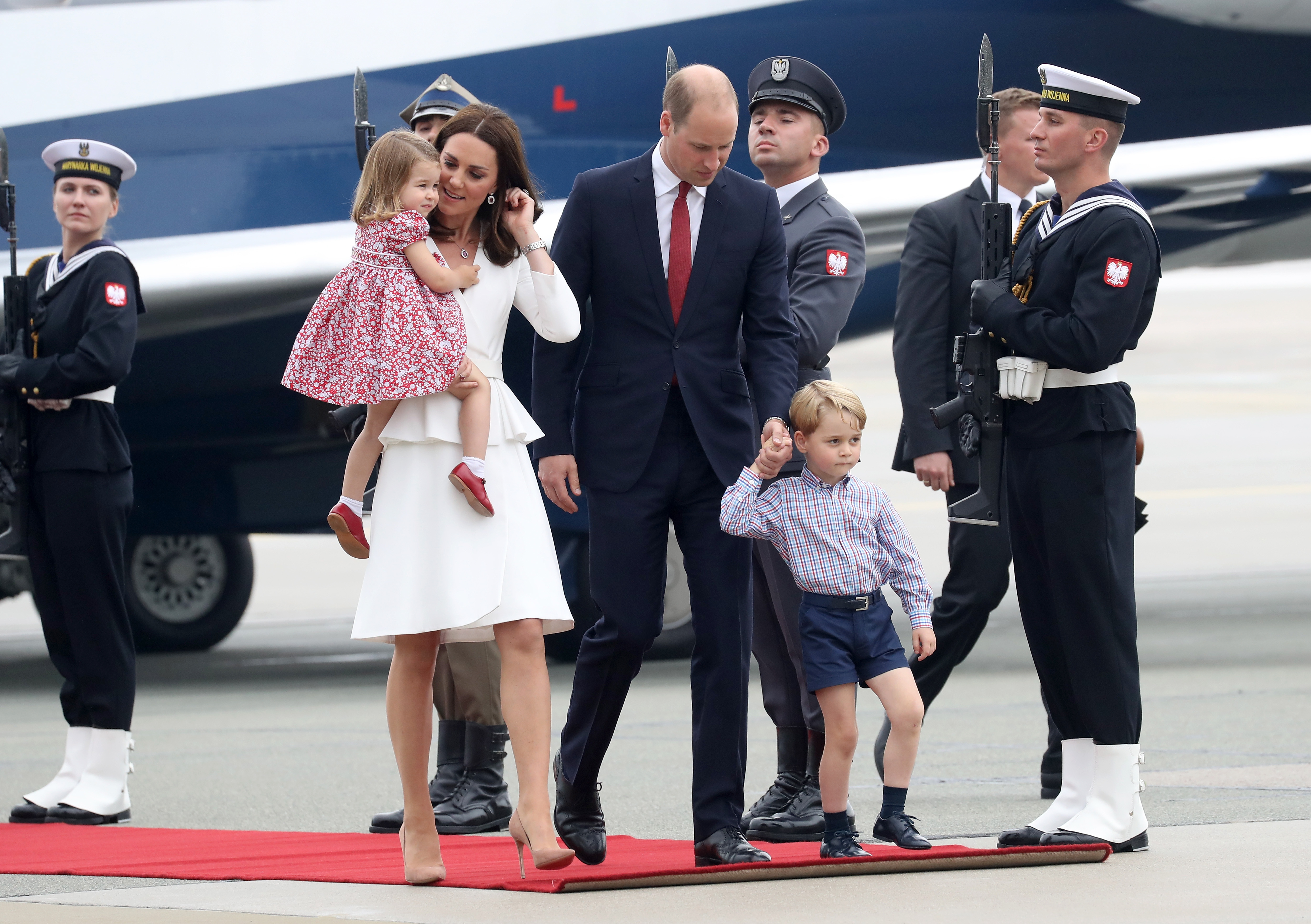 Catherine, Duchess of Cambridge and Prince William, Duke of Cambridge with their children Princess Charlotte of Cambridge and Prince George of Cambridge as they arrive in Poland.