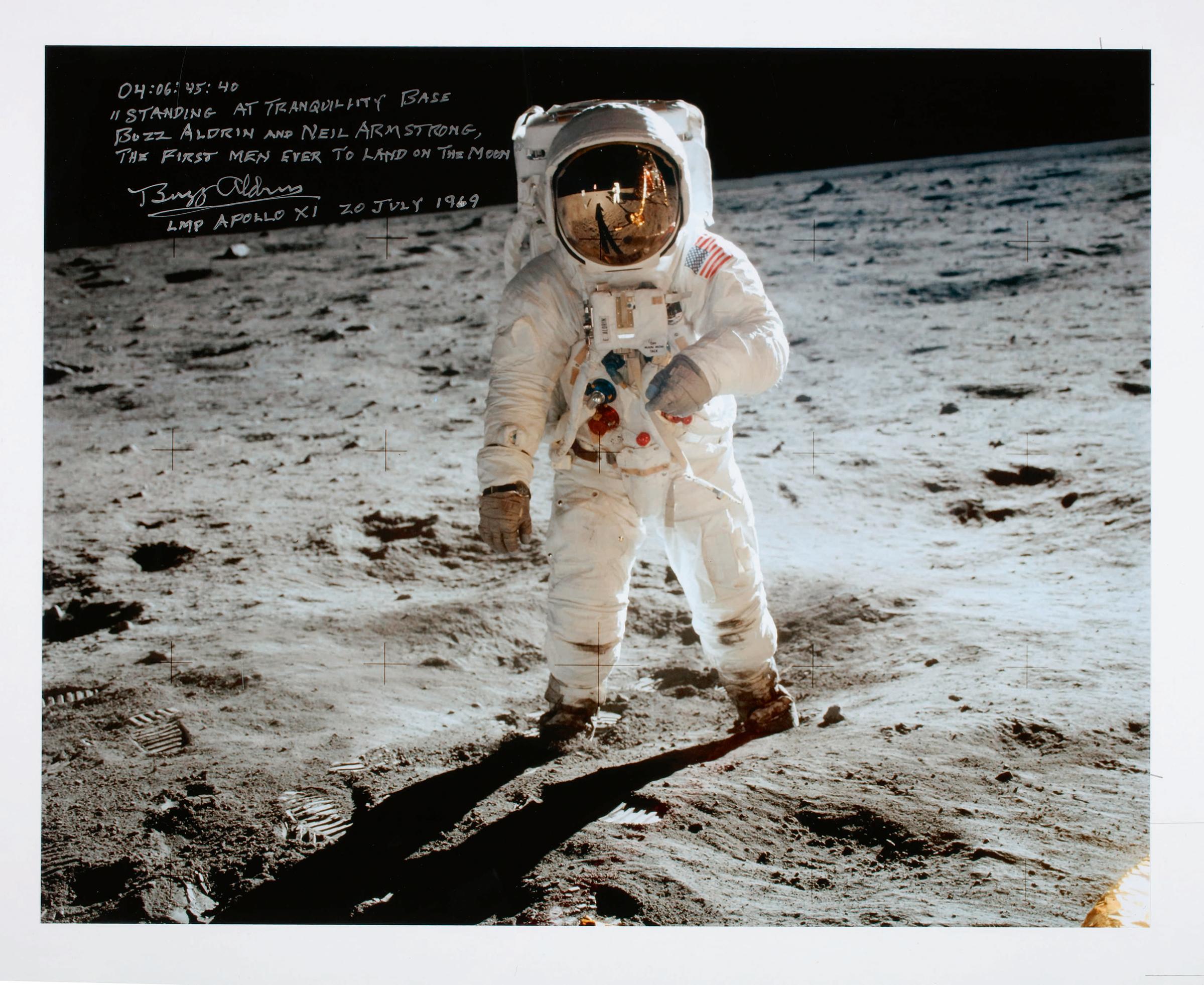 Buzz Aldrin at Tranquility Base. The Apollo program’s most iconic image. Large color photograph taken by Neil Armstrong of Buzz Aldrin during their Apollo 11 moonwalk. Signed & inscribed by Buzz Aldrin.