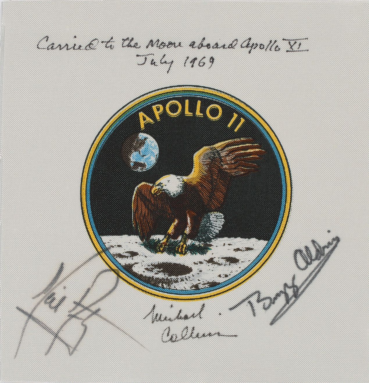 Flown to the Moon on Apollo 11-Command Module Pilot Michael Collins’ Crew-Signed Apollo 11 Emblem. One of the very flew flown Apollo 11 mission artifacts to be signed by Neil Armstrong.