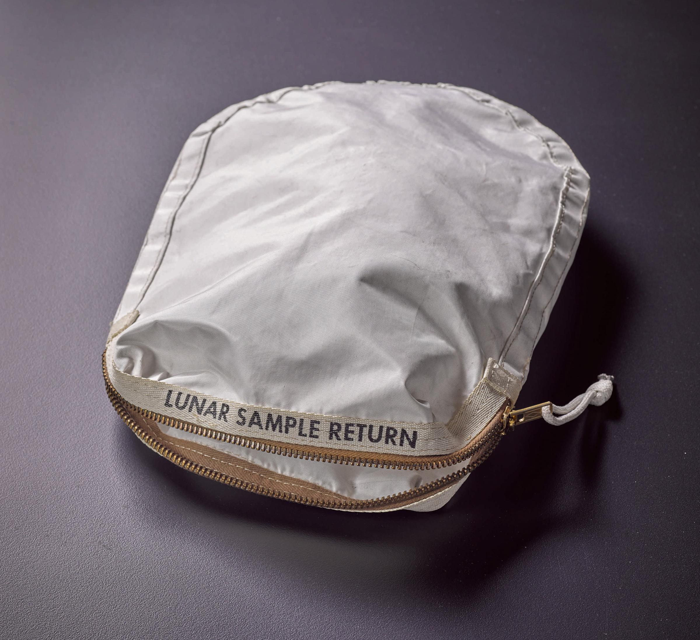 Apollo 11 Contingency Lunar Sample Return Bag. Used by Neil Armstrong on Apollo 11 to bring back the very first pieces of the moon ever collected – traces of which remain in the bag. The only such relic available for private ownership.