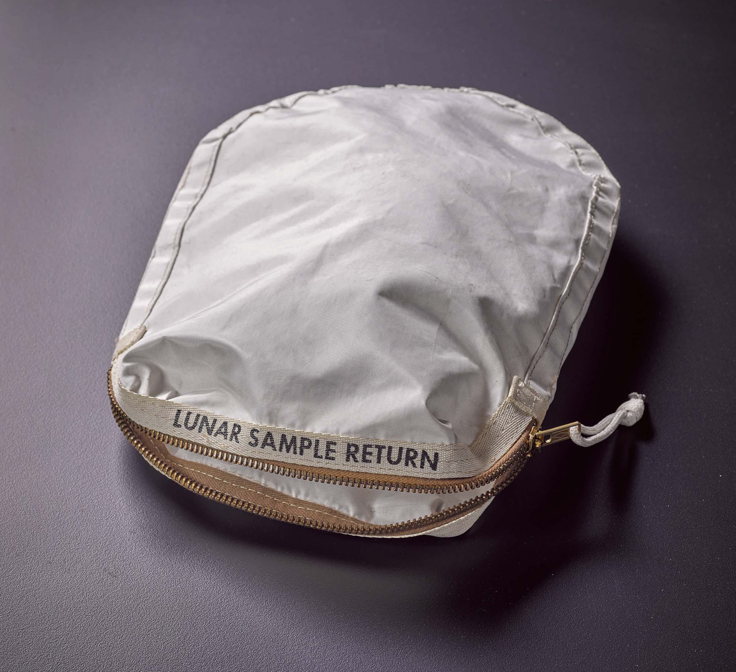 Apollo 11 Contingency Lunar Sample Return Bag. Used by Neil Armstrong on Apollo 11 to bring back the very first pieces of the moon ever collected, traces of which remain in the bag. (Courtesy of Sotheby's)