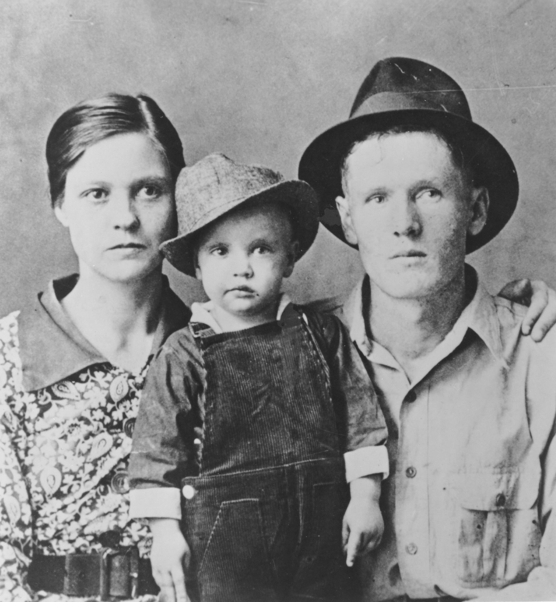 Elvis Presley poses for a family portrait with his parents Vernon Presley and Gladys Presley in 1937 in Tupelo, Mississippi.