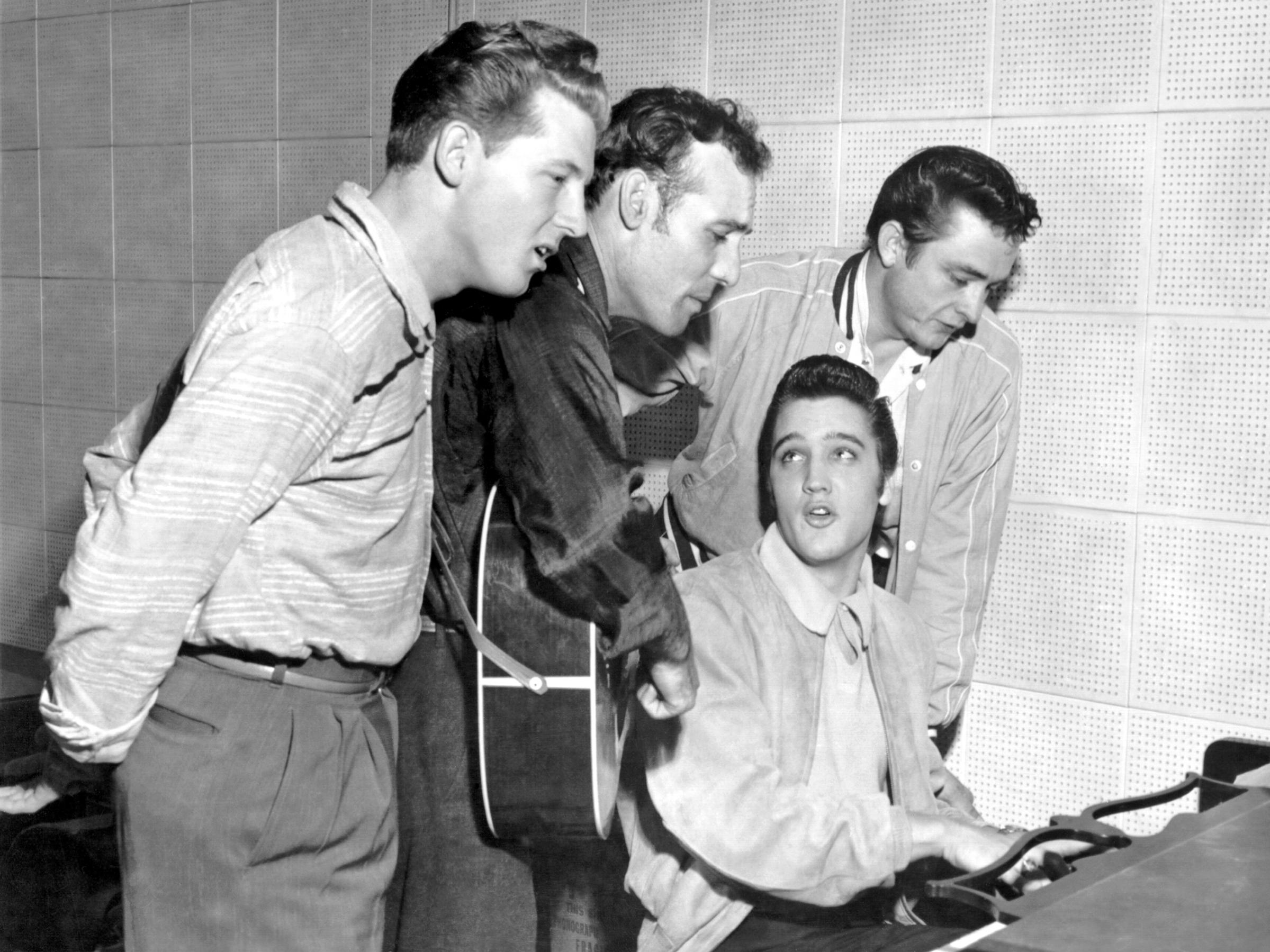 Rock and roll musicians Jerry Lee Lewis, Carl Perkins, Elvis Presley and Johnny Cash as "The Million Dollar Quartet" December 4, 1956 in Memphis, Tennessee. This was a one night jam session at Sun Studios.