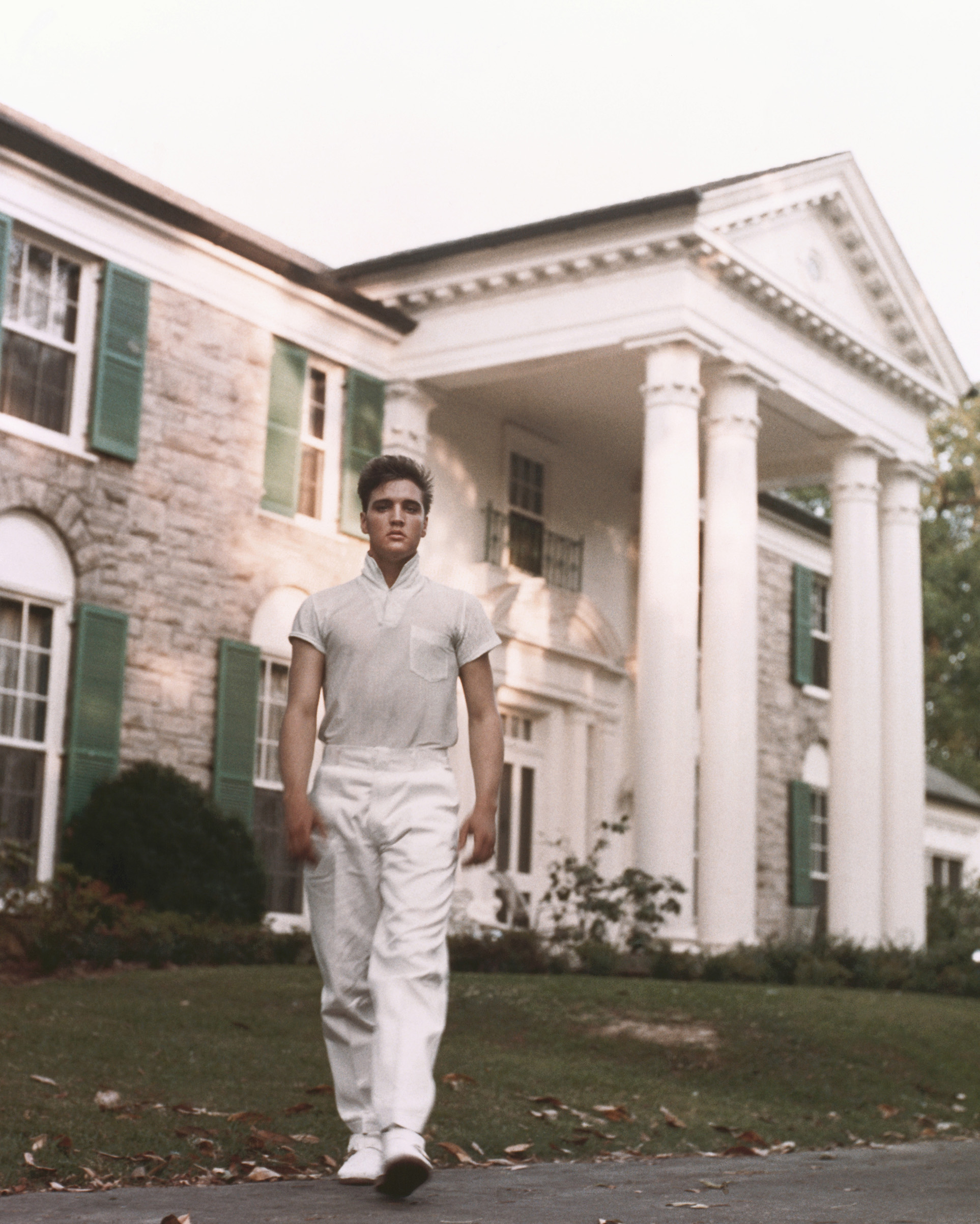 Elvis strolls the grounds of his Graceland estate in, Memphis, Tenn. circa 1957.
