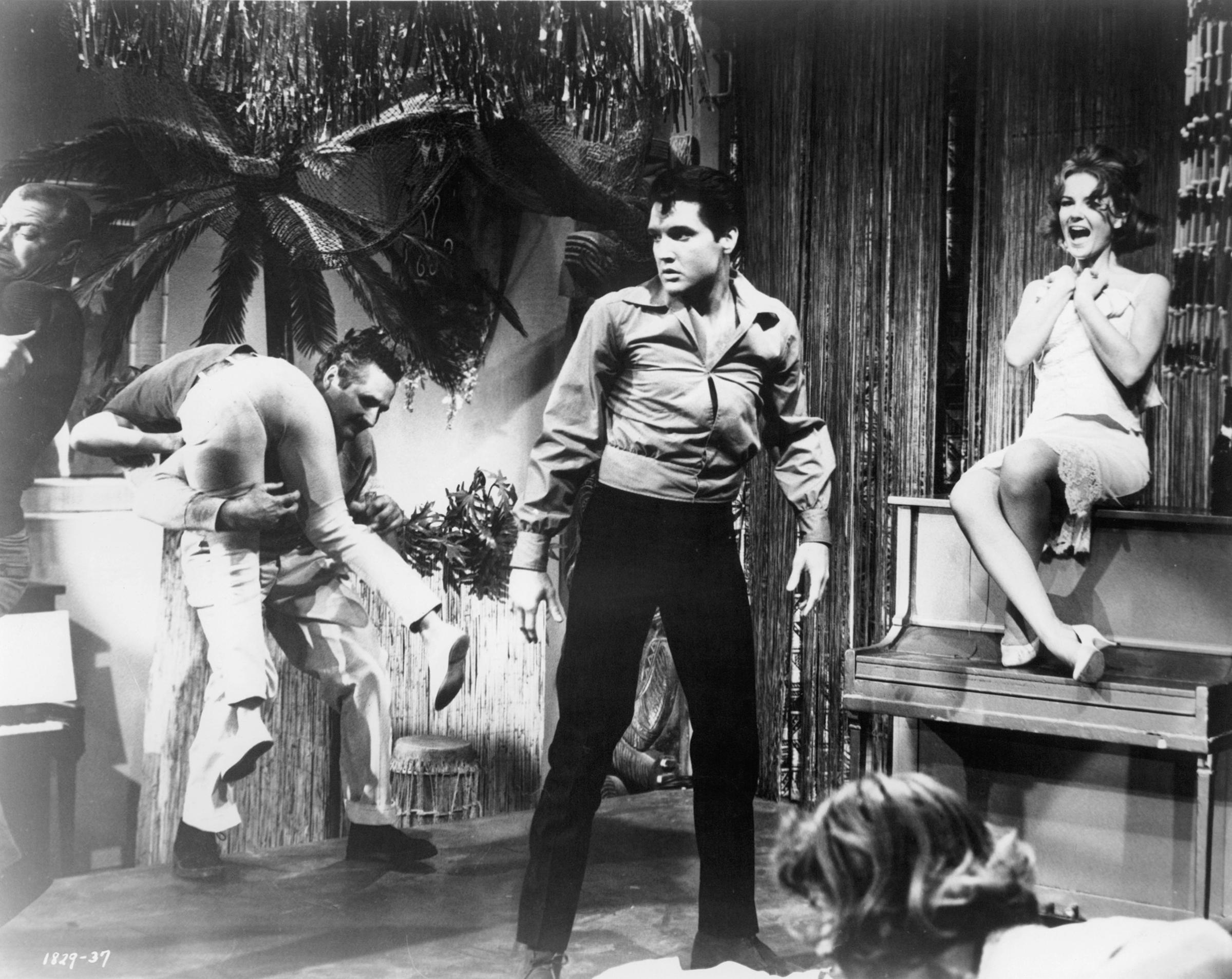 "Girl Happy" 1965, Elvis Presley comes to the rescue when a fight erupts after Shelley Fabares (seated on piano) tries to do a strip-tease act.