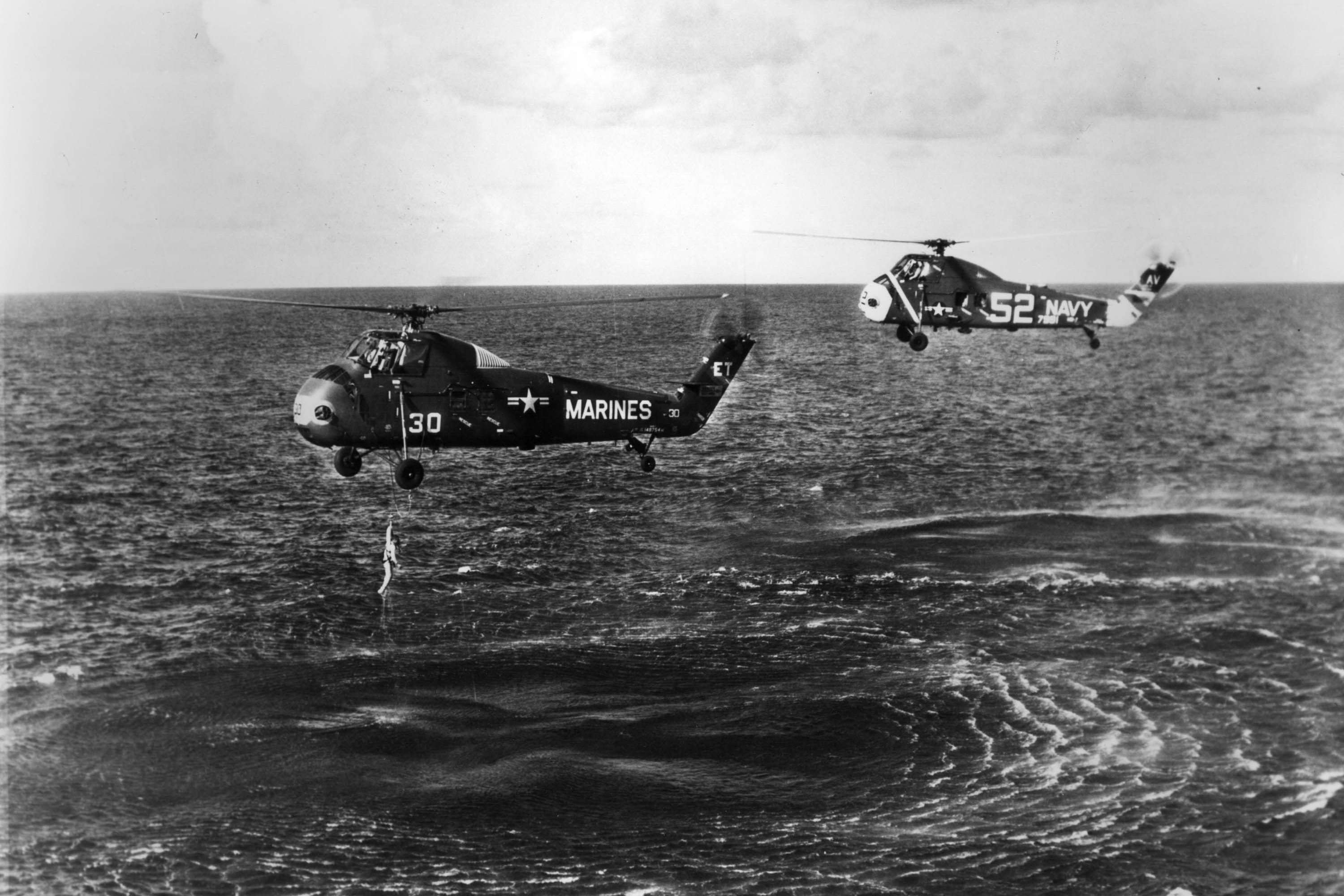 July 21, 1961, Worldwide Mercury Astronaut Virgil 'Gus' Grissom Is Pulled From The Ocean. His Spce Capsule 'Liberty Bell 7' Sank After He Opened The Side Hatch. (NASA/Getty Images)