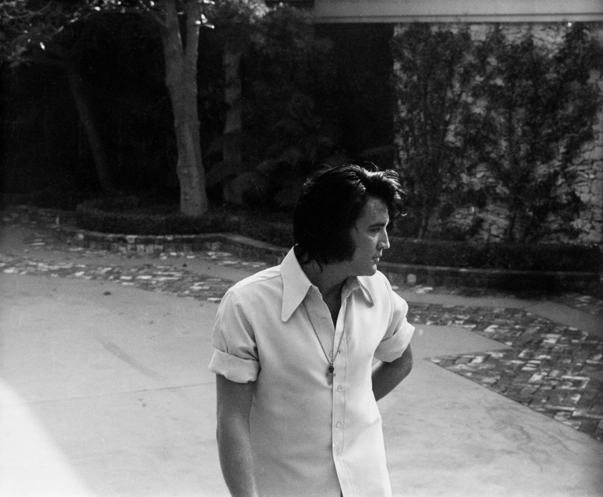 Elvis Presley in his driveway at Graceland, circa 1970's.