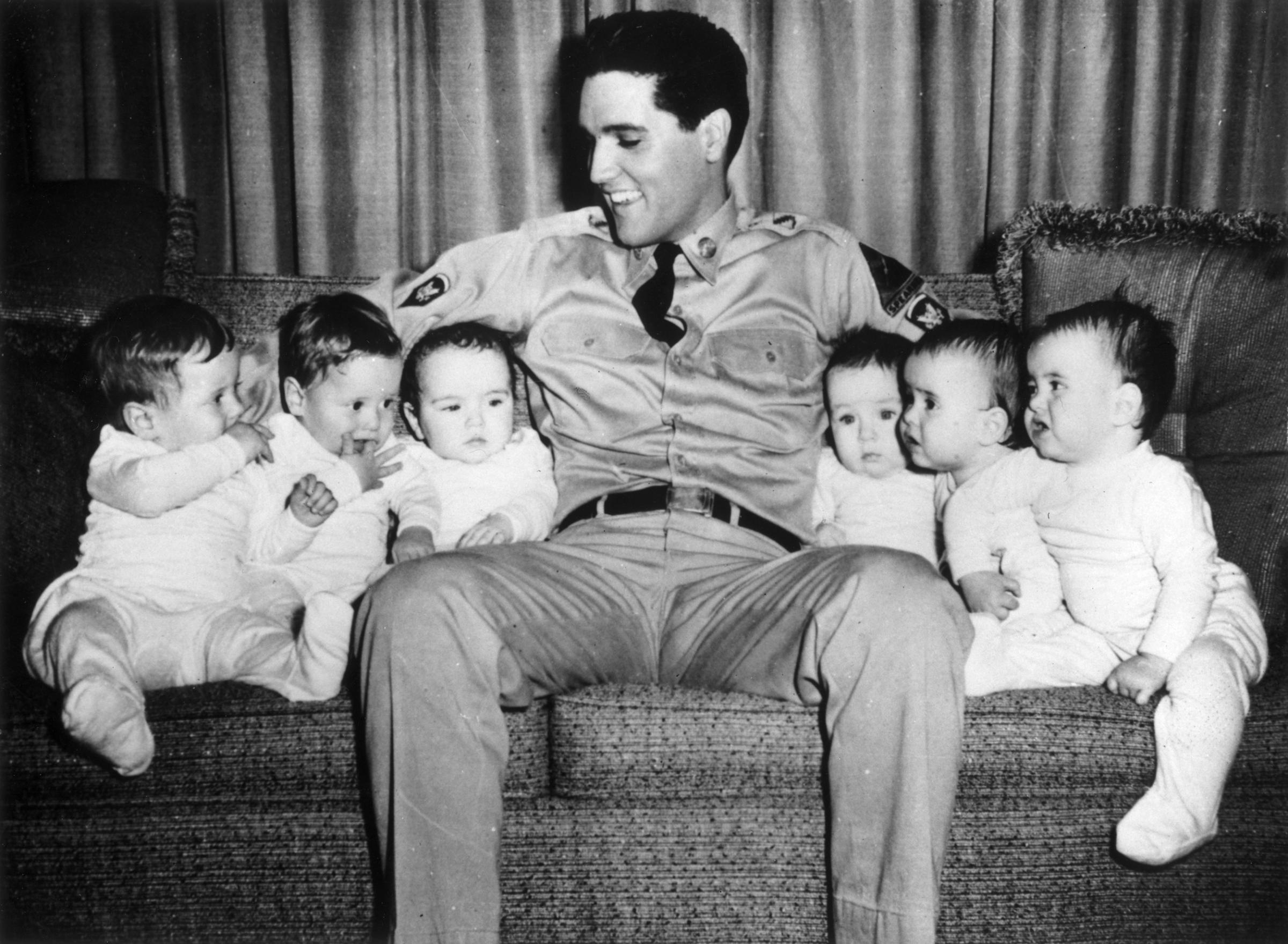"GI Blues"1960, Elvis with six babies (three sets of twins) during the making of the film.