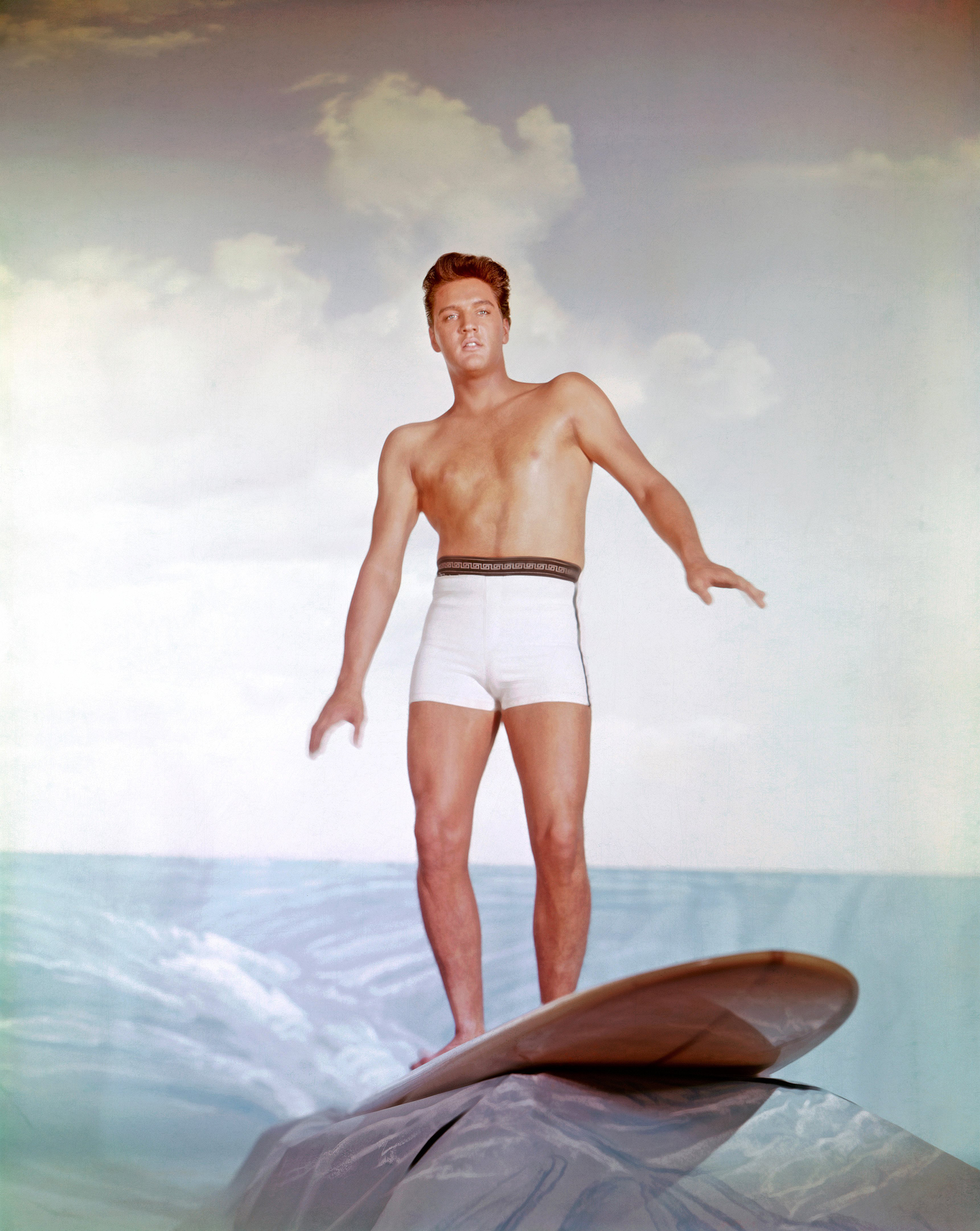 "Blue Hawaii"1961, Elvis on a surfboard.