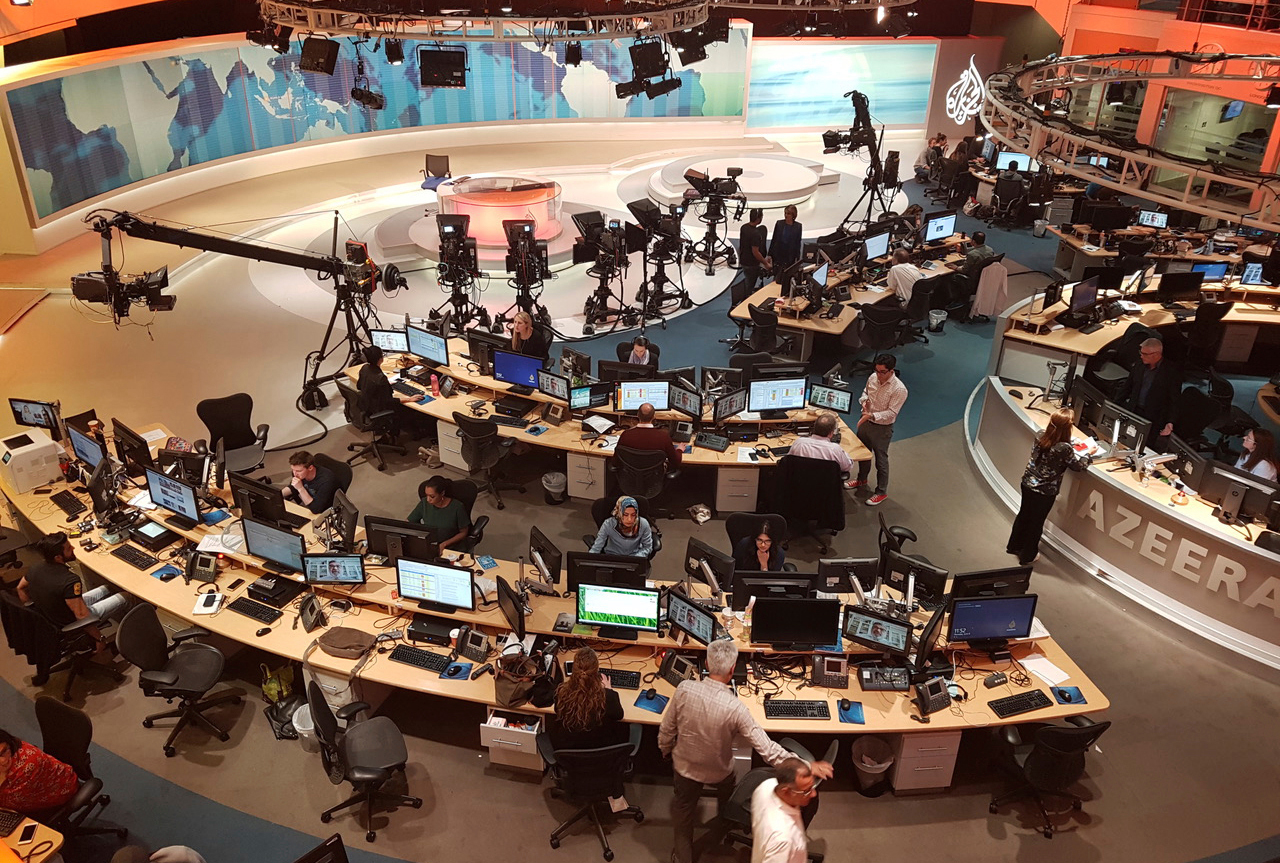 Al Jazeera staffers work in Doha on June 8, 2017. (Malak Harb—AP)