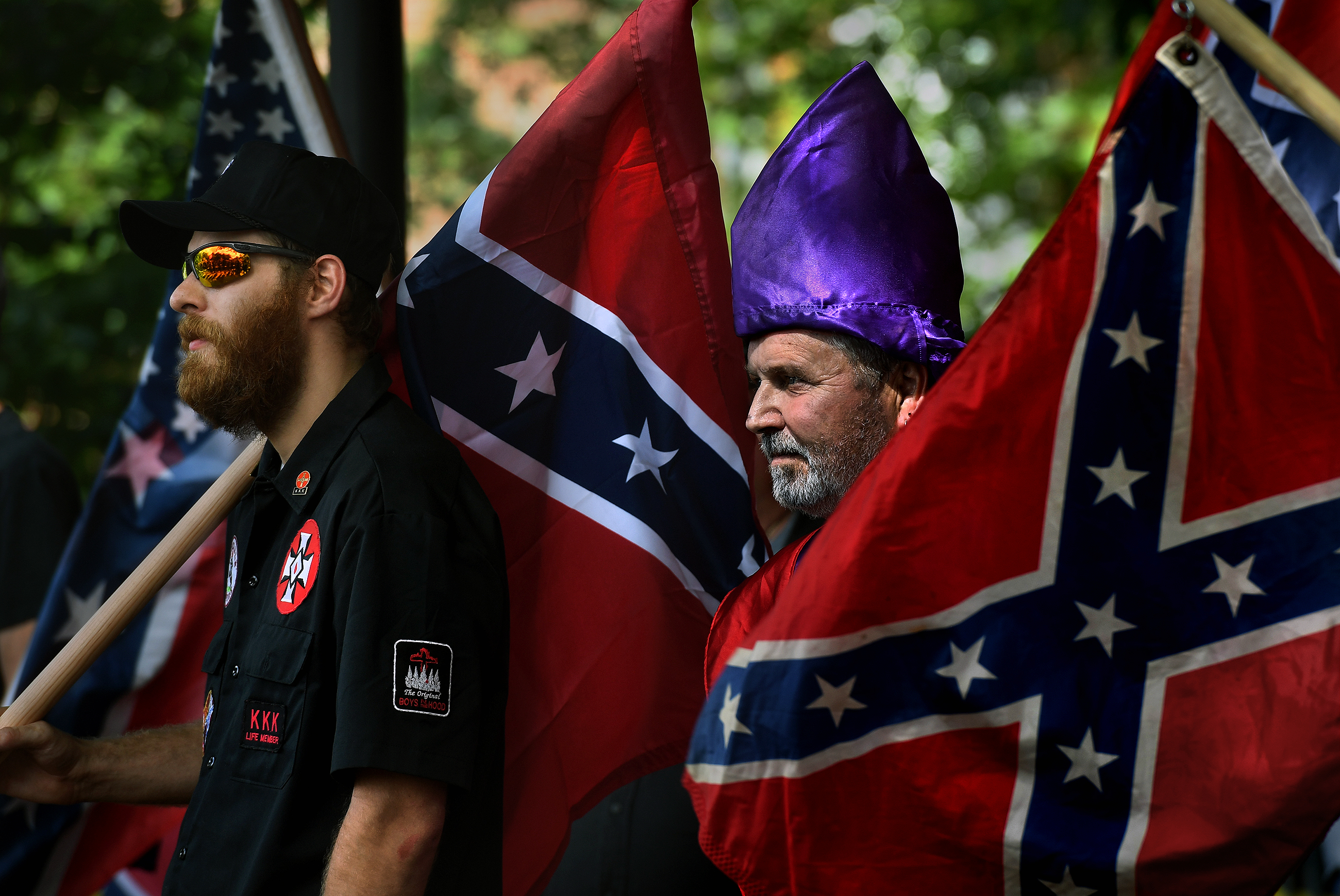 KKK members watch as anti-KKK groups chanted against them. (Michael S. Williamson&mdash;The Washington Post/Getty Images)