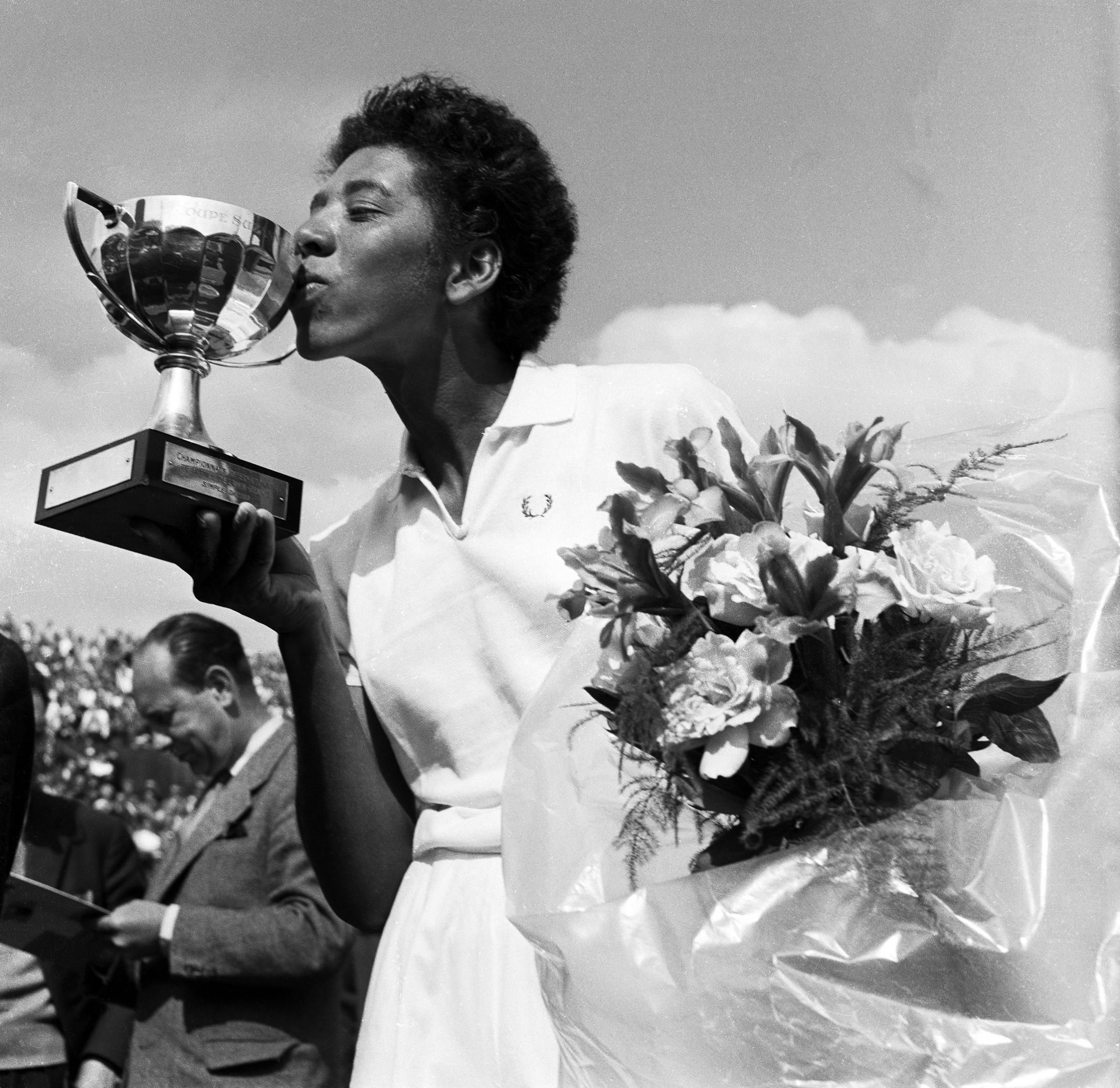ALTHEA GIBSON: The first black athlete to cross the color line of international tennis and th efirst person of color to win a Grand Slam title in 1956.