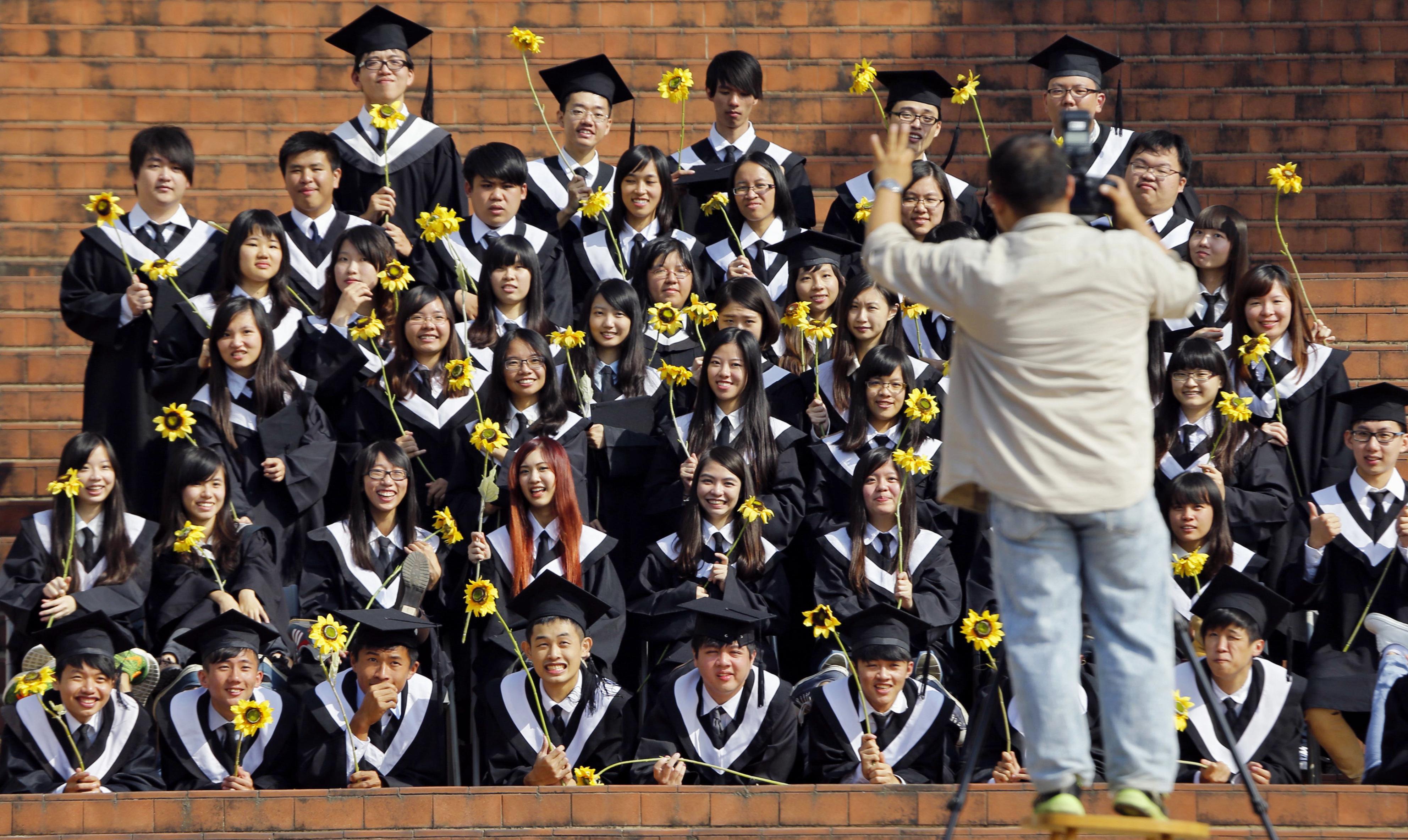 A group of students from the National Chiayi University in Chiayi City, southwestern Taiwan, poses for a class photo on campus on Dec. 8, 2014. (Kazuhiko Yamashita—Kyodo)