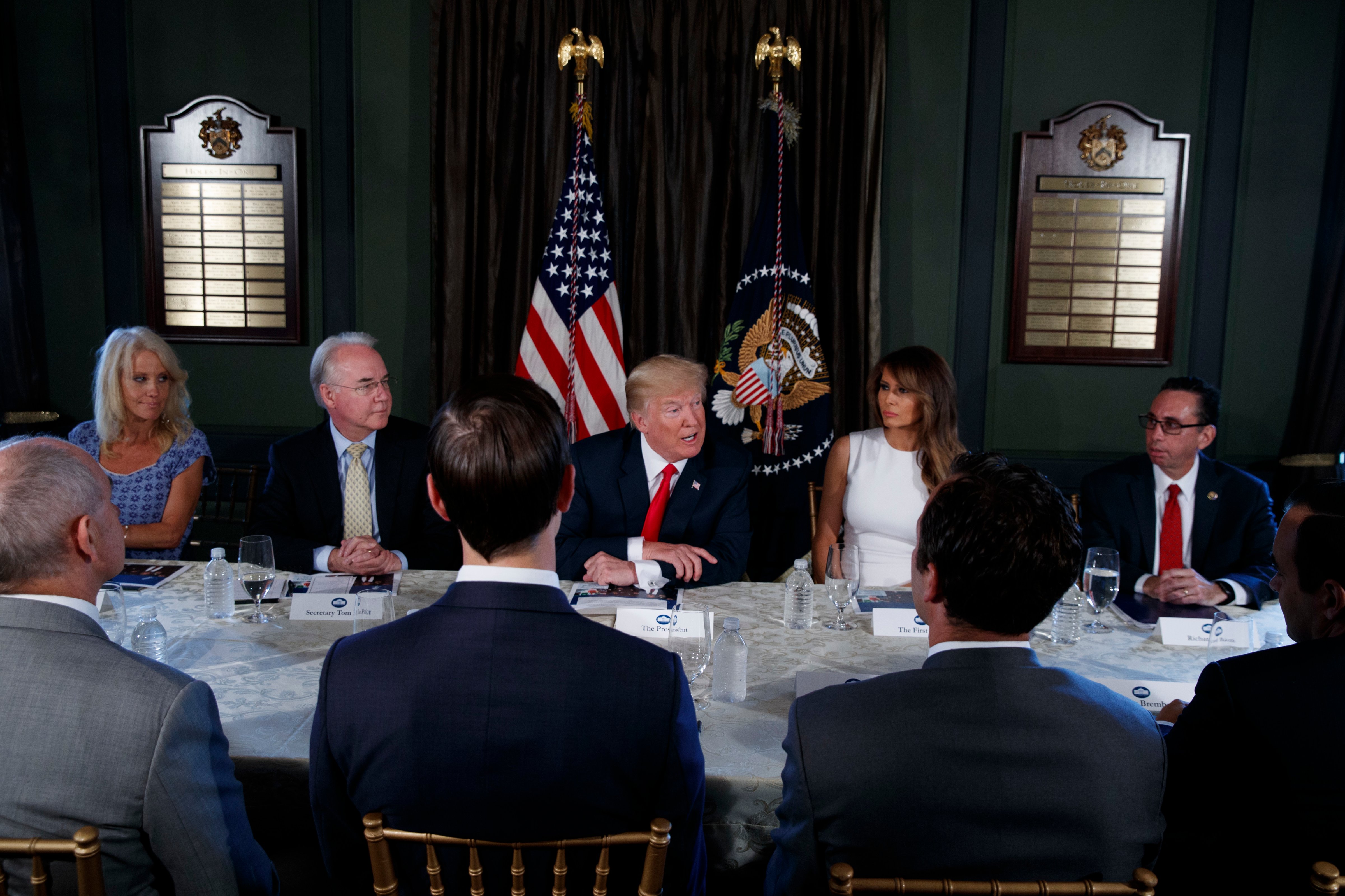 Trump speaks during a briefing on the opioid crisis on Aug. 8, 2017, at Trump National Golf Club in Bedminster, N.J. From left are, White House senior adviser Kellyanne Conway, Health and Human Services Secretary Tom Price, Trump, First Lady Melania Trump, and National Drug Control Policy acting Director Richard Baum. (Evan Vucci—AP)