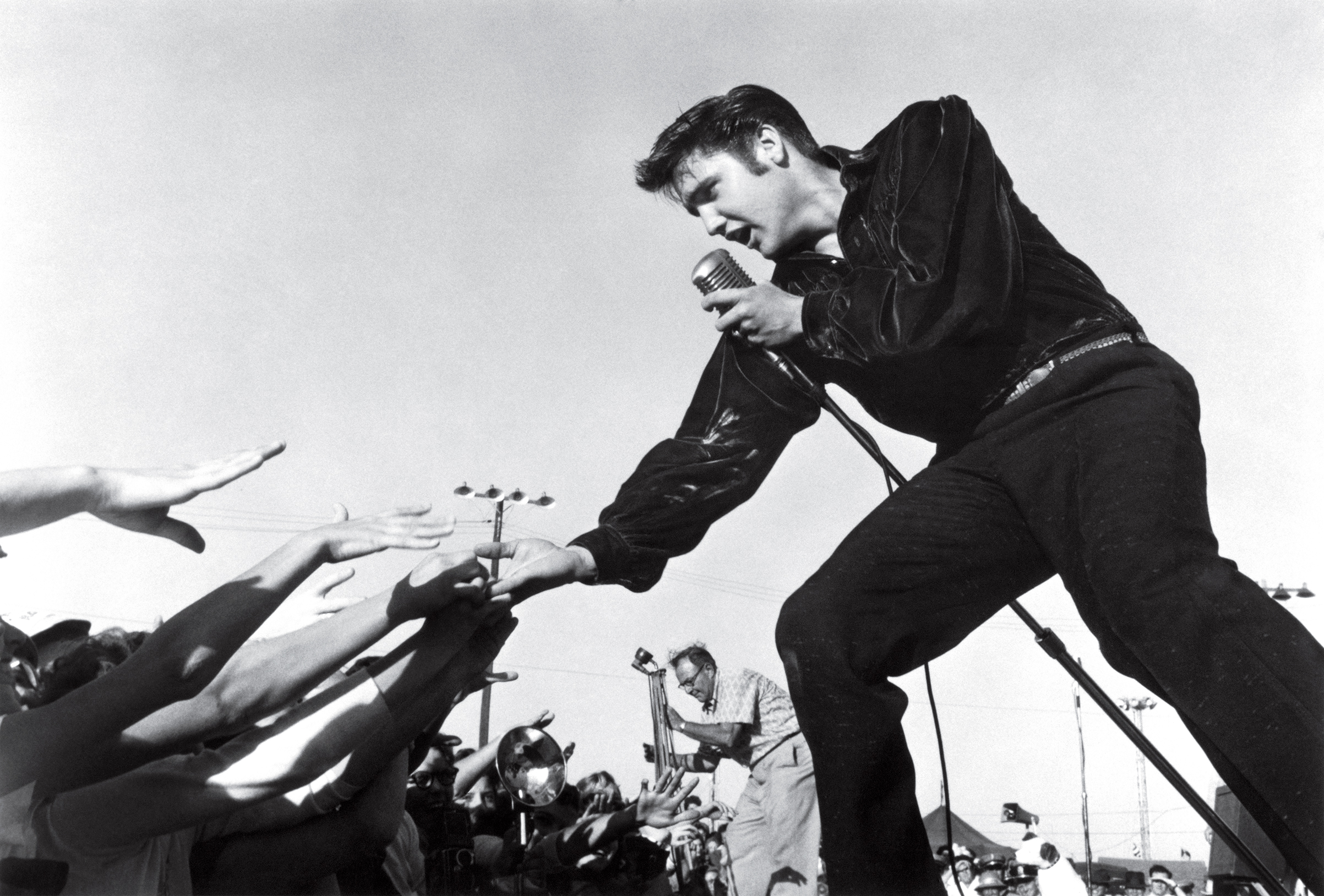 Elvis Presley performing at the Mississippi-Alabama Fair and Dairy Show in 1956 in Tupelo, Miss. (Roger Marshutz—MPTV)