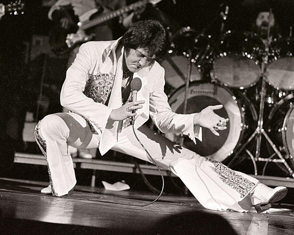 Elvis Presley performs in concert at the Milwaukee Arena on April 27, l977 in Milwaukee, Wisconsin. (Ronald C. Modra/Sports Imagery—Getty Images)
