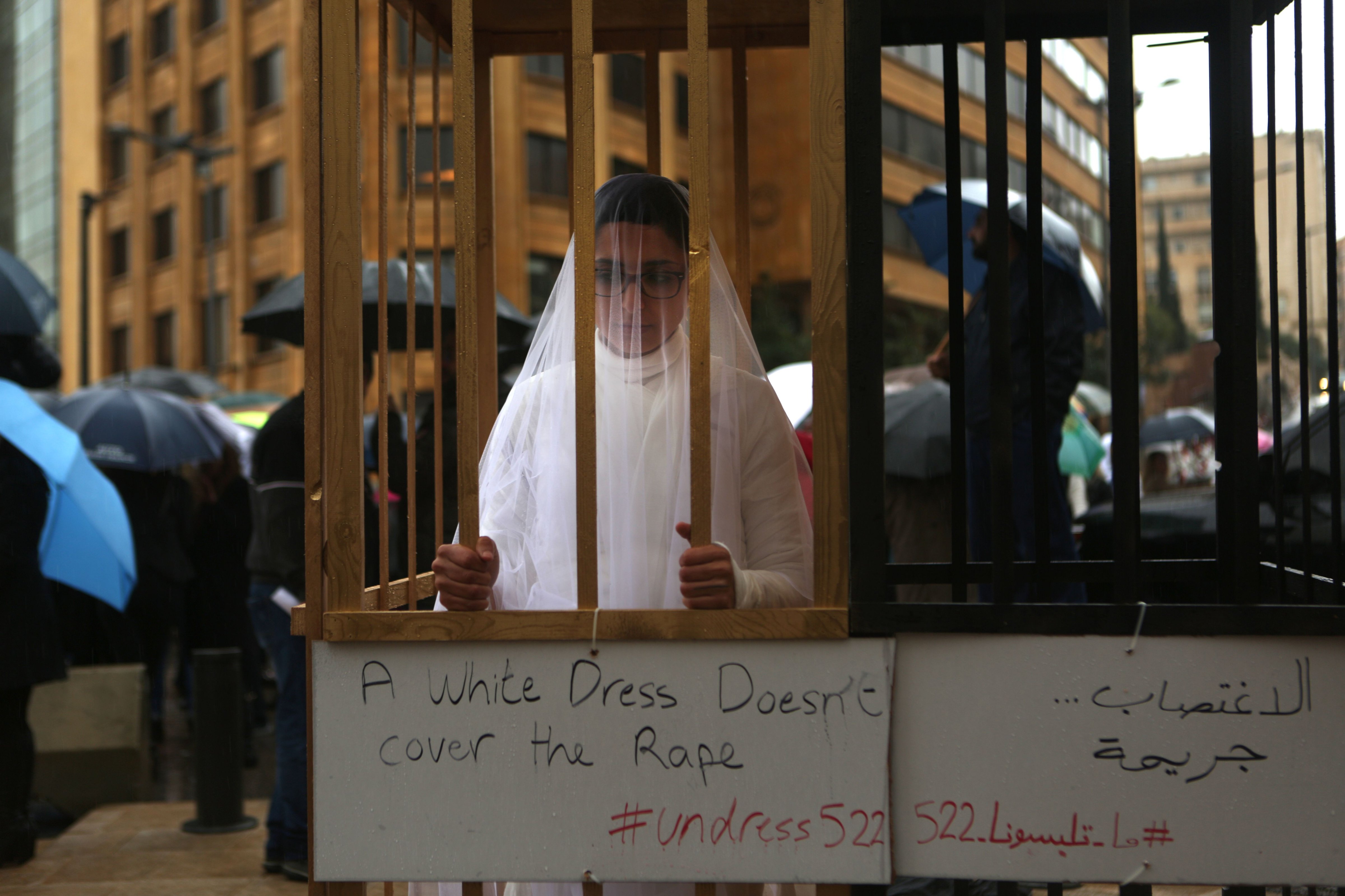 An activist from the Lebanese NGO Abaad dressed as a bride and wearing bandages during a protest near the parliament in downtown Beirut on March 15, 2017. (Patrick Baz—AFP/Getty Images)