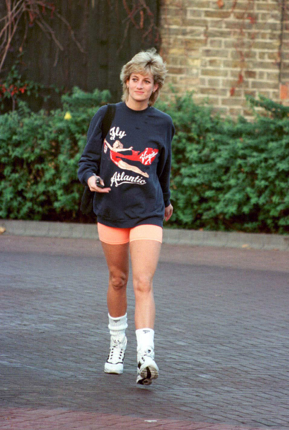 Even though Diana was mostly spotted in glamorous get-ups, she could rock casual looks too — here, in November of 1995, a month before her official divorce from Prince Charles, she wears a sporty pair of shorts and a Virgin Atlantic sweatshirt.