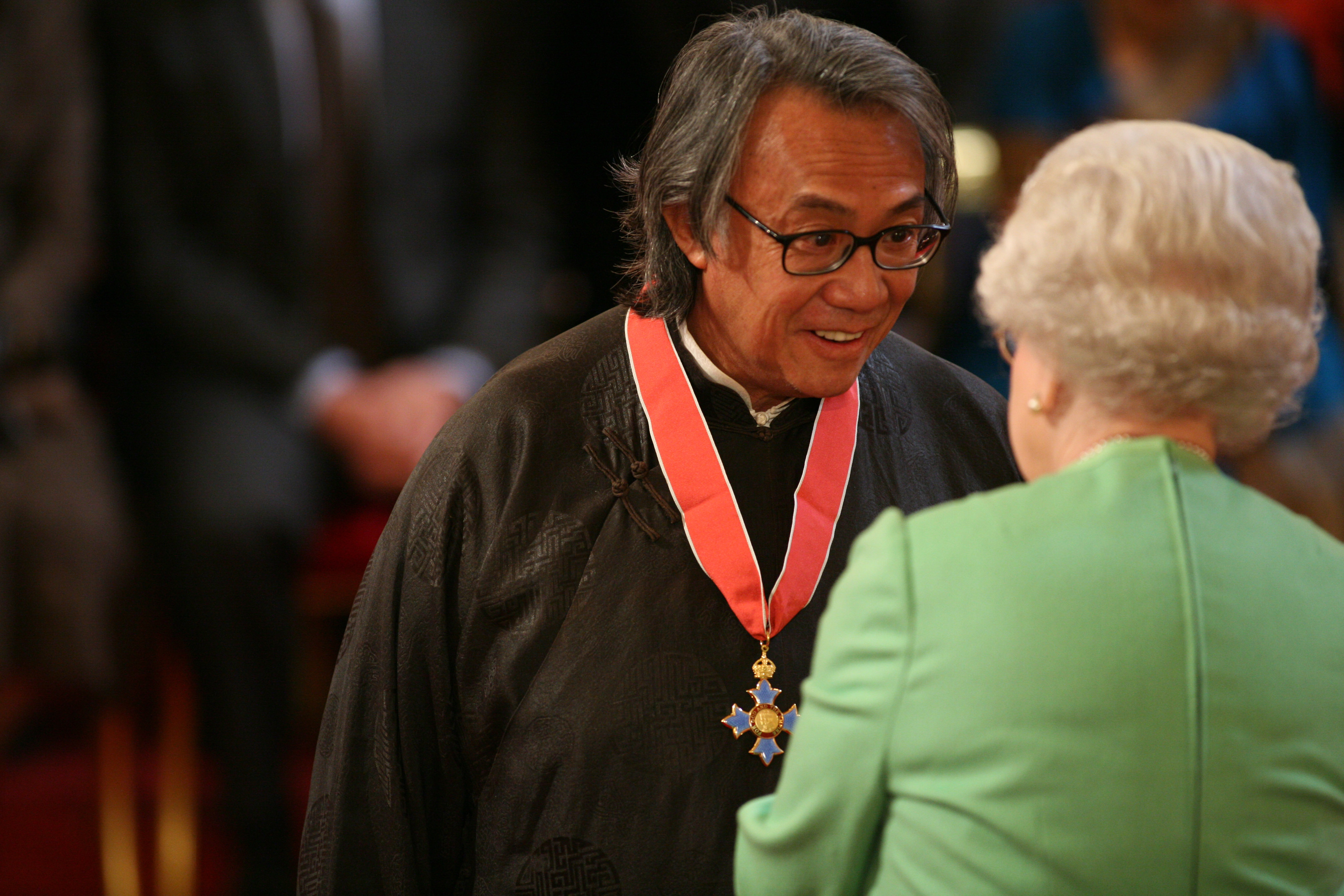 Sir David Tang is knighted by the Queen at Buckingham Palace in February 2008. (Lewis Whyld—PA Images via Getty Images)