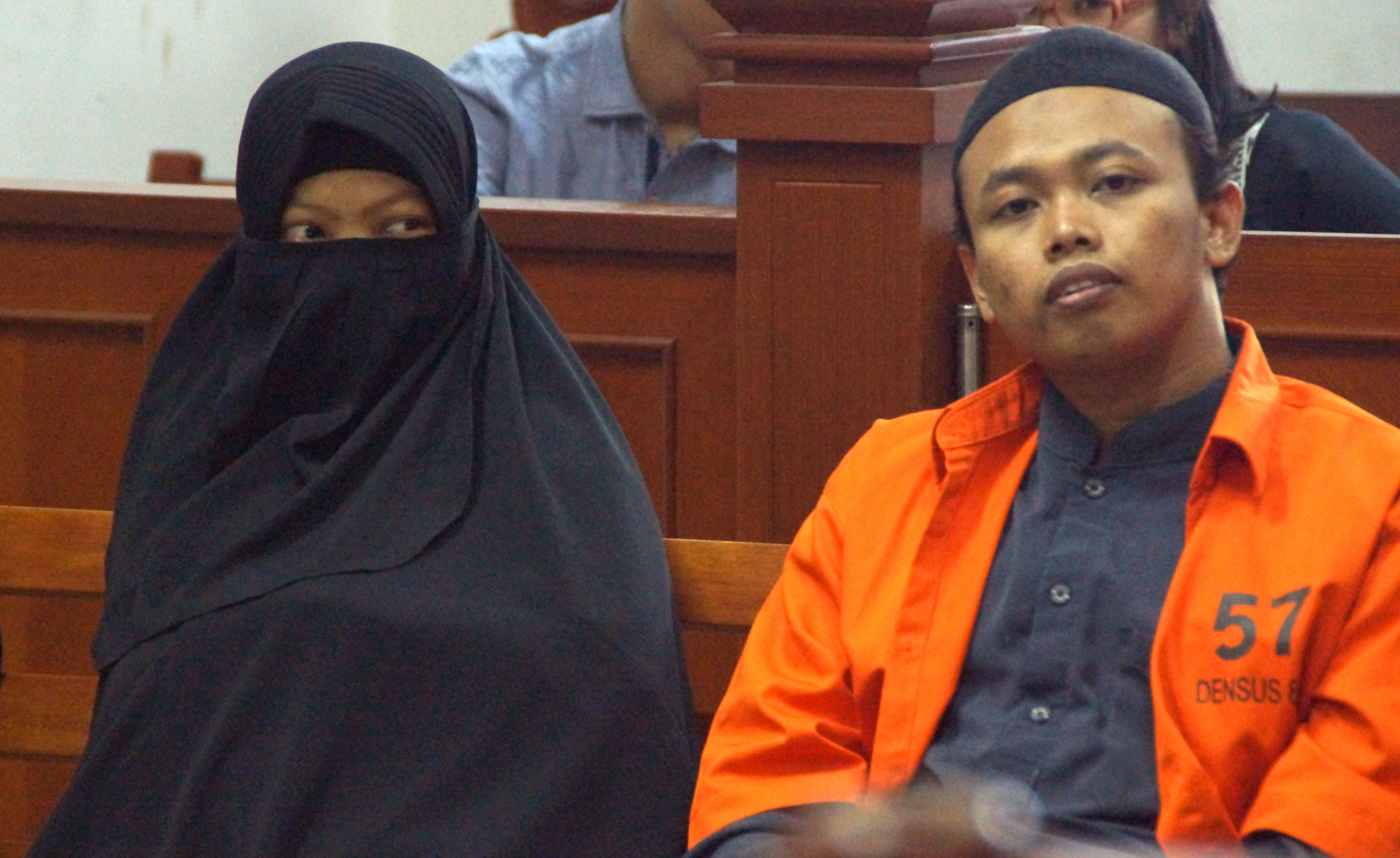 This Aug. 23, 2017 shows Dian Yulia Novi (L) with her husband Nur Solikin during their trial at East Jakarta District Court in Jakarta. (Arie Firdaus—AFP/Getty Images)