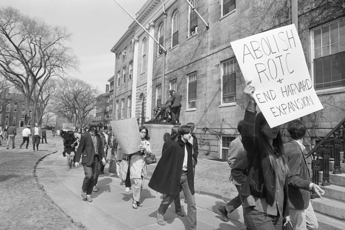 Students demonstrating at Harvard University  march past the statue of John Harvard en route to taking over University Hall in April of 1969 (Bettmann / Getty Images)